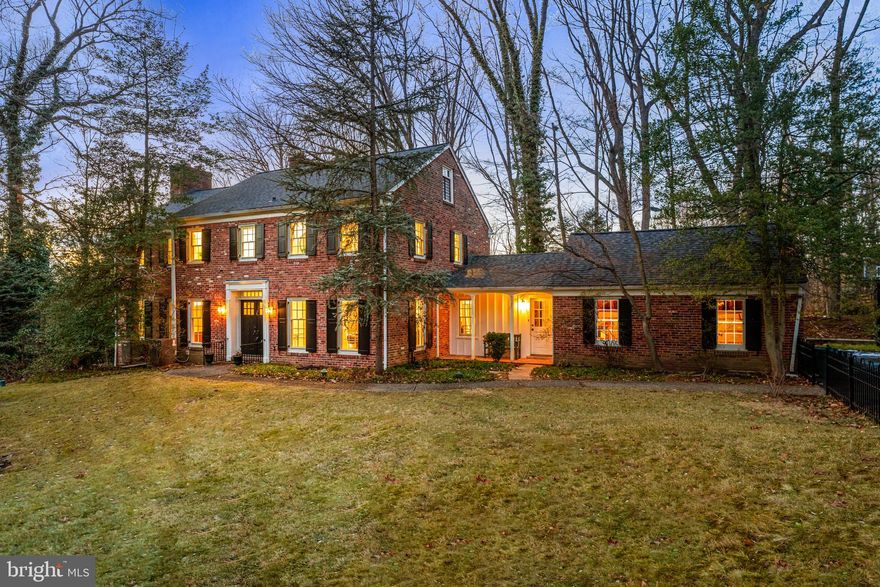 20 Ridgewood Road in Wayne, located in the highly sought-after Northwoods neighborhood, is a stately brick Colonial on a fabulous lot that is just under an acre, with a gracious entry foyer, featuring 4 bedrooms plus an office, as well as 3 newly renovated baths, and island kitchen and office on a private lot with a pool and walkout basement. Known for its strong sense of community, Northwoods is part of the award-winning Radnor School District and a prestigious Wayne address.
This elegant brick Colonial offers very well laid out ample above-ground living space, plus a walk out finished lower level with ample windows, four bedrooms, two new full baths, and two half baths. With exceptional living spaces, modern updates, and a thoughtfully designed layout, it’s perfect for both everyday living and entertaining.
Step inside to find a gracious formal living room with a large picture window overlooking the expansive backyard, custom built-ins, crown molding, and a wood-burning fireplace. With a wood burning fireplace this is a wonderful room for get-togethers and holiday celebrations (as well as cheering on the Phillies and Eagles). French doors off this room lead to a brick patio. The formal dining room boasts oversized windows, detailed molding, and hardwood floors, creating a warm and inviting setting for gatherings.
The remodeled kitchen is the heart of the home, featuring light cabinetry, an arched window, a large island, and an open layout that flows into the dining and family areas. A butler’s pantry, double ovens, and an eat-in breakfast space make it both stylish and functional. The kitchen is the perfect place to gather for every day meal preparation and every day living. The remodeled, open flow Dining Room offers space for hosting larger family gatherings and celebrations. Adjacent to the kitchen, the remodeled first-floor laundry room and mudroom provides additional convenience with an outside entrance to the covered front porch.
 The main-level office/den is a true retreat with large windows, natural light, and a wood-burning fireplace — ideal for remote work or quiet time. The powder room, also newly renovated, completes this level.
Upstairs, the very large primary suite features two spacious closets, French doors to a private balcony, and a newly renovated en-suite bath (2024) with a seamless glass shower and elegant subway tile finishes. Three additional bedrooms share an updated hall bath, and a walk-up attic provides excellent storage or potential third floor for expansion.
The fully finished lower level bonus room offers true family space and features a fireplace, built-in bookshelves, and windows allowing abundant natural light. This space has been a favorite for movie nights, sleepovers, and summer gatherings. The walk out lower family room doors offer direct access to the flagstone patio, pool, and spa.  The backyard is a private oasis, perfect for outdoor entertaining, with multiple patios, a resurfaced pool (pebble sheen finish), and mature trees providing a serene setting.
Recent updates include a new roof (2022), HVAC systems (2018 & 2022), a repaved driveway (2024), and fresh interior and exterior painting (2024). Additional features include a security system, a pool safety fence, and a two-car garage.
Perfectly situated just minutes from downtown Wayne with its many restaurants and boutique stores, the Wayne Train Station, and array of local parks and playgrounds. Major roadways and King of Prussia are within minutes as well. Enjoy the convenience of nearby shopping, dining, and top-tier Radnor School District education, Amtrack to New York close by all while experiencing the warmth and close-knit feel of this exceptional comm