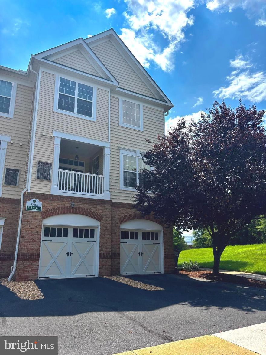 AGENTS - PLEASE READ AGENT PRIVATE REMARKS BEFORE SENDING QUESTIONS! THANK YOU!
A wonderful place to call home! Move-in ready 2-bedroom, 2.5-bath, two-level corner-unit condominium featuring a 1-car garage, additional driveway parking for a second vehicle, and plenty of nearby guest and overflow parking.

Nestled in the serene community of The Ridges at Belmont, part of Belmont Country Club, this charming home offers the perfect blend of comfort, convenience, and amenities for an enjoyable lifestyle.
Built in 2007 by the prestigious builder Toll Brothers, this home features an inviting open floor plan with a breakfast bar that provides additional seating with bar stools. Beautiful hardwood floors, fresh paint, and abundant natural light enhance the space throughout. The spacious living and dining areas flow seamlessly into a well-appointed kitchen with pantry storage

The garage features new epoxy flooring and a storage closet, offering additional flexibility for storage or workspace.

Enjoy beautiful nature views and direct access to the Washington & Old Dominion Trail from the windows and private balcony—perfect for outdoor recreation.

Residents enjoy access to Belmont Country Club amenities, including family pools and an adult pool with food and beverages available for purchase, along with dining, a fitness center, tennis courts, sand volleyball, basketball courts, soccer fields, and playgrounds. Golf memberships are also available for golf enthusiasts. For more information about the club and amenities, please visit the Belmont Country Club website,
.
The HOA covers exterior maintenance, including the roof, common area snow removal, trash, recycling, water, and discounted internet service—providing convenient, low-maintenance living.

Ideally located near Route 7, Route 28, and the Dulles Toll Road, with shopping, restaurants, and entertainment nearby. Just minutes from Ashburn Metro Station and Washington Dulles International Airport, offering excellent commuting and travel convenience.

The area offers abundant outdoor recreation, including hiking in the Blue Ridge Mountains, fishing and kayaking along the Shenandoah River, and visiting the region’s many wineries and breweries—making weekend getaways and day trips easy and enjoyable.

Schedule your showing today!