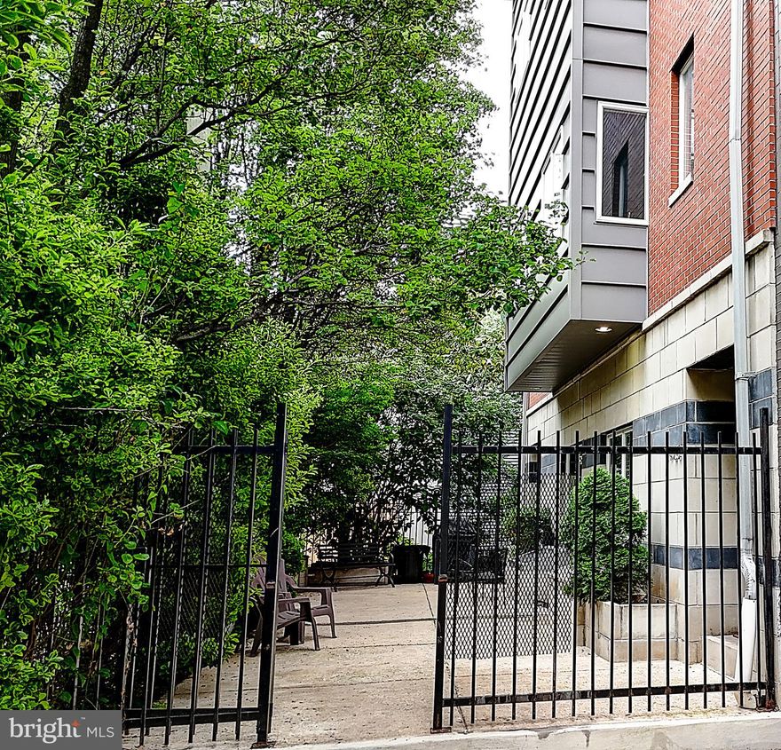 A Modern Masterpiece in the Heart of Graduate Hospital
1424 Kenilworth Street | Gated Community | 22’ Wide Townhome | 2-Car Garage

Step into the epitome of refined urban living with this architecturally striking, 22-foot-wide contemporary townhome nestled in an exclusive gated enclave in the sought-after Graduate Hospital neighborhood. From its dramatic black ceramic foyer to the breathtaking skyline views from the rooftop deck, this home is a rare blend of modern elegance and everyday luxury.

First Floor:
Enter through a bold, oversized doorway into a chic black-tiled foyer that sets the tone for the home’s elevated design. This level features a spacious guest suite with a full bath—ideal for in-laws, guests, or a private home office. Direct access to the two-car garage and a fully finished basement offers flexible space for a gym, media room, or wine cellar.

Second Floor – Grand Entertaining Level:
The main floor is an entertainer’s dream, boasting soaring ceilings, wide-open spaces, and floor-to-ceiling windows that flood the home with natural light. The gourmet chef’s kitchen is a showstopper—anchored by a dramatic black quartz waterfall island, custom ebony wood cabinetry, a walk-in pantry, and premium appliances including a Sub-Zero refrigerator, six-burner range with hood, pot filler, and dishwasher. Adjacent, the formal dining room and expansive living area with a walkout patio provide effortless flow for hosting. A discreet powder room adds convenience and charm.

Third Floor – Owner’s Sanctuary:
Retreat to the primary suite, a sumptuous sanctuary featuring large bedroom, a cozy sitting area with fireplace, custom-designed walk-in closet, and spa-inspired bath. Indulge in  the  soaking tub beneath sunlit windows, a glass-enclosed stall shower, and a double vanity adorned with modern ceramic tile. A second bedroom on this level serves perfectly as a nursery, dressing room, or private office.

Fourth Floor – Private Quarters + Skyline Views:
Two additional generously-sized bedrooms share a sleek hall bath and are complemented by a dedicated laundry room. These two bedrooms can be easily be converted back to one very large bedroom .
Step outside to your rooftop terrace, where panoramic views of the Center City skyline create an unforgettable backdrop for morning coffee or evening soirées under the stars.

Bonus Features:
• 3,884 sq ft of living space
• Designer finishes throughout
• Gated community privacy and security
• Two-car garage with interior access
• Rooftop deck with 360° views

This rare contemporary jewel offers sophisticated city living with the feel of a private estate—all within minutes of Rittenhouse Square, top-tier dining, theatres and world-class shopping.