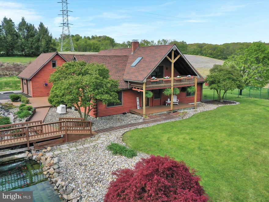 Bring your Mustangs and bring your horses to 91 Tobias Rd.! This 3800 ft.²
cedar log home sits on 22 beautiful scenic acres. Just minutes from Blue Marsh
and Plum Creek. This custom built home was specifically designed for auto and
outdoor enthusiasts. Inside, the glowing vaulted ceilings and sky lights allow for
endless amounts of sunlight to fill the home during the day and star gazing with
a fresh breeze at night. The great room welcomes you with its corner gas
fireplace, wide plank hard wood floors and picturesque views from every
window. Home cooked meals are meant to be made in kitchens like this one.
Storage space from top to bottom, a double oven, movable center island and
counter space for days. The main floor also offers a bonus space that can be
used as first floor office or guest space with a full bathroom. If you're looking for
a place to lay down the cards, then stroll into the large entertaining room that
has its own entrance, large wet bar and bathroom. This room also has direct
access to the large fenced in backyard and pool.
The primary bedroom of this home feels more like an elegant yet quaint
getaway. With its floor to ceiling stone fireplace, vaulted ceilings, expansive
closet areas , private vanity and bathroom and views overlooking tree-lined
fields, you just may never leave your bedroom! There are two other bedrooms
on the second floor. Both have large closets, individual heating and air
conditioning systems and solid hardwood floors. Another eye-catcher is the loft
area that over looks the great room and has a sliding glass door that opens to
the large second level deck. The views from the deck are priceless and the
sounds of the waterfall and Koi pond just below are extremely tranquil.
Okay now it's time to get to work, so let's head out to the garage. The large pole
barn/garage has 4 large bays, 3 in the front and 1 side bay. All large enough for
trucks and RV’S. A 40ft x 20ft additional work area with tons of storage takes
up the back portion of this garage along with an office area.
The most recent addition to this property is the 6 bay car collectors paradise.
Less than a year old, this garage is temperature controlled with epoxy coated
flooring, and designed for plenty of space between each car to keep your prized
possessions dent free. Race upstairs to check out the finished 44 x 20 ft loft
area. The luxury loft has a unique color changing inset fireplace and recessed
lighting.
This home has had so many great additions and upgrades including new roof,
very recently installed mini-splits through out, Generac generator, professional
landscape and waterfall, and partially finished basement.
The home is currently not enrolled in Clean & Green ( Act 319). Once enrolled,
taxes adjustments will be reflected.
So get your engines revving and prepare yourself for a one of a kind property.