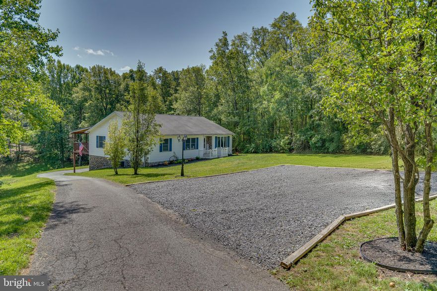 Over 2.4 acres with no HOA located outside of Berkeley Springs right off Rt 522 . This house is in great condition. Enjoy your evenings on the large covered rear deck. The basement is huge and awaits your finishing touches. Lots of room to design it to suit your needs. Outside you can spend your time down at the pond. Current owners take their paddle boat out when water is high enough. Pond stays mostly full for winters. Many upgrades which include newer HVAC, newer water system, newer stainless steel appliances, etc. Very easy to see.