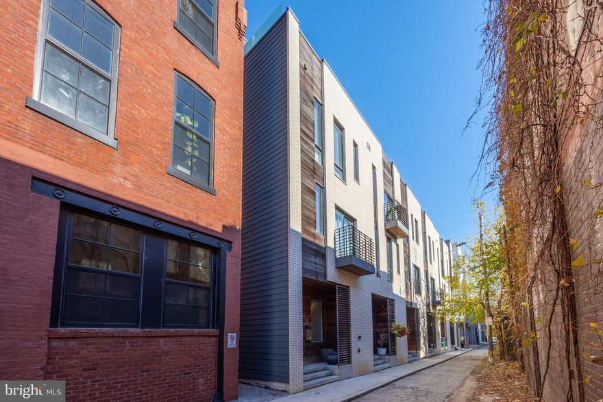 This home features modern luxury living with inclusions like wide-plank hardwood flooring throughout, imported kitchen cabinets with quartz counter tops and tiled backsplash. Park in your deeded spot and head in to your first floor which has great living space and chef style kitchen. Head downstairs for a fully finished basement with high ceilings! The primary suite features a massive walk-in closet, full bathroom with a wall hung dual vanity and fully tiled shower with frameless glass shower door. The additional three bedrooms will provide you with all the space you need. All full bathrooms include 12 x 24 tile flooring. The roof deck is a spectacular addition for outdoor entertaining with incredible city and bridge views. Many fine features included with this home. Over 2,500 square feet under roof.  Schedule your tour today and secure your new home!