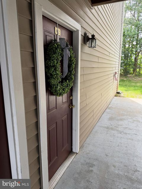 Photo of 11009 Kinship Court #102, MANASSAS, VA 20109 (MLS # VAPW2121632)