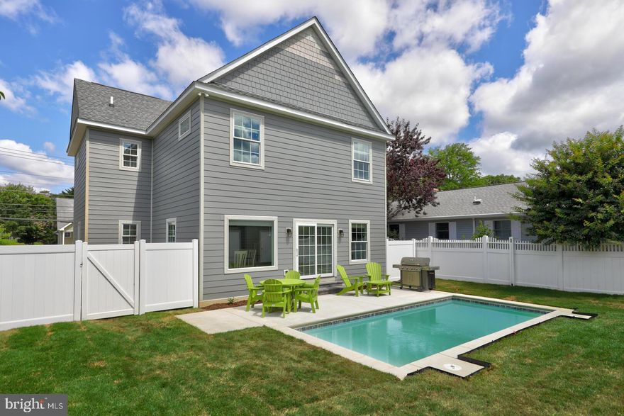 MASSIVE PRICE REDUCTION! This custom home built in 2021 features 5 BEDROOMS, 5.5 BATHS, a full finished BASEMENT and the ever desirable inground, heated 22ft x 10ft POOL located right in downtown Rehoboth. While this property would make an excellent primary or second home, the investment potential as a rental property is second to none. Built with a firm understanding of what renters are looking for, this home has an extremely impressive rental history. This property has over $115K on the books for 2023 with dates still left to book! What’s more, this home is being sold turn-key, fully furnished with high end pieces. Upon entry, you’ll be welcomed into the spacious living room which reaches through to the kitchen and dining area. Luxury vinyl plank flooring flows throughout the entirety of the home's living spaces and bedrooms. The first floor primary suite entrance is encased by double doors and boasts a large bedroom, sun filled windows and an attached bath with custom tiled shower and dual vanities. The kitchen has stainless steel appliances, custom pendant lighting and a large island perfect for entertaining. With large sliding glass doors leading out to the pool, you are only steps away from the backyard oasis. Here you’ll find the large concrete pool complete with patio area, BBQ grill with propane gas line, irrigation system and large outbuilding for storage, all fenced in with 6 foot privacy fencing. Back inside, the kitchen flows into the dining space, making gathering for meal times a breeze. The dining area is accented by custom millwork, an enormous picture window and plenty of space to fit all guests of the home. An entirely separate living area and game center awaits in the fully finished basement. This space is enhanced with recessed lighting, huge pool table, large flat screen TV multiple sitting areas and even a Skee Ball machine! Upstairs you’ll find the remaining 4 bedroom suites, complete with their own full, custom tile work bathrooms and pocket doors. The laundry room is conveniently located on the 2nd floor. Walk to Dogfish Head Brew Pub, Rise Up, Egg & so many more popular Rehoboth Beach shops, restaurants and bars. The beach and boardwalk are just a few short blocks away – nearby Hickman Street offers a direct route.