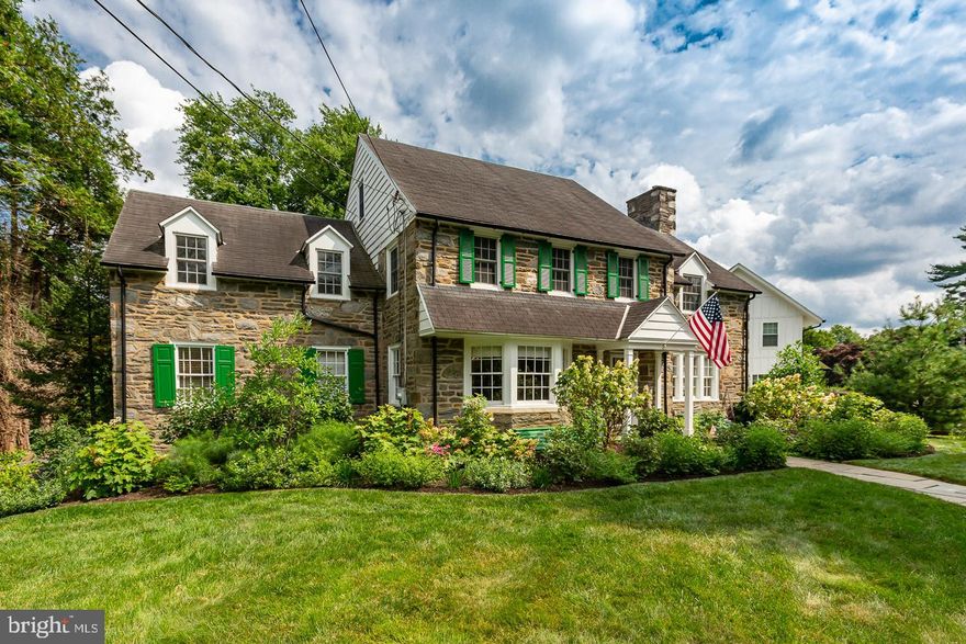 Situated in one of the most desirable neighborhoods on the Main Line, this stately stone colonial sits on a flat, professionally landscaped .45 acre property. This home offers an elegant and spacious floorplan that boasts high quality updates and charming architectural details such as deep windowsills, built-in shelves, hardwood floors and wainscotting along with graceful arched windows and doorways. 
Enter through the center hall to a well-proportioned living room with recessed lighting, lots of windows and a wood burning fireplace. The living room flows outside to a covered patio - perfect for entertaining or as a quiet oasis for relaxing. Across the center hall, a sun filled dining room with bay windows, crown molding and wainscotting, flows to a generous sized chef’s kitchen  with a subzero refrigerator, pantry closet and an island with seating. The kitchen extends to a family room with a gas fireplace, built in shelves and windows on all 3 exposures. The family room opens onto a mahogany deck overlooking the fenced in backyard, ideal for daily family living or al fresco dining and entertaining. An office and a half bath complete the 1st floor. The lower level contains a finished basement with plenty of room for gym equipment and game tables, in addition to large unfinished storage spaces and a laundry room with stairs up to the backyard. 
The second floor includes four bedrooms and three full bathrooms. The spacious owner’s suite has an ensuite bathroom and double closets with built ins. The guest room with ensuite bath is private at the end of a hall; two additional bedrooms and a hall bath complete the second floor. The third floor has a bedroom with bathroom ensuite – ideal for guests or an au pair and a large attic with plenty of storage space.
Updates include installation of two A/C units and a boiler, a new hot water heater, new windows on the 2nd and 3rd floor, custom window treatments and blinds throughout, refinished hardwood flooring on the 1st and 2nd floor, 2.5 new bathrooms and professional landscaping designed bloom with the changing seasons. 
Located in the award-winning Lower Merion School District and the highly sought high school choice catchment. This property offers the comforts of suburban living with outstanding walkability to downtown Narberth, R5 train SEPTA bus routes and numerous other conveniences.