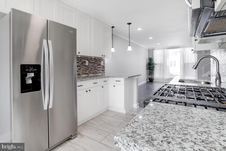 ***ALL OFFERS ARE DUE TUESDAY, APRIL 12TH at 12 Noon.*** Step inside and you will fall in love with the spacious open floor plan that provides plenty of sunlight from the floor-to-ceiling windows along the front wall. The streamlined kitchen is perfect for entertaining guests sitting at the breakfast bar or cooking a midweek meal. Treat yourself to a primary bedroom with an ensuite bathroom that boasts a skylight and a shower with built-in niche. An ensuite bathroom is a rare find - you deserve it! The additional bedrooms share the hallway bathroom with tub/shower. If you use the parking pad out back, you can enter the home through the mudroom, which can also be used for storage. Looking for more storage? The bonus shed is awesome for toys and tools. This end unit home has a charming white picket fence and woodland landscaping that separates it from nearby Moore's Run Park.  This location is convenient to stores, restaurants, and schools, as well as major commuter routes to the city and county. Move-in ready and sold in As Is condition.