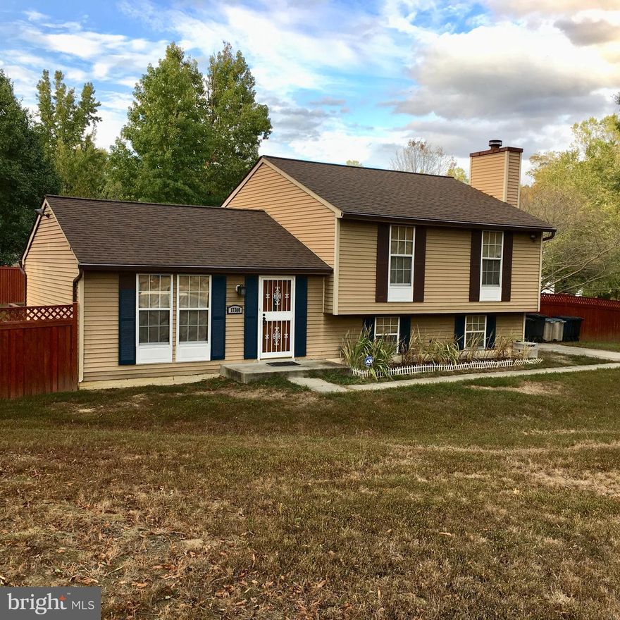 Great Value in Upper Marlboro with spacious corner lot, split-level home and two spaces available in drive way. Property is being sold as-is. Beautifully finished hardwood floors, updated kitchen with new cabinets and stainless-steel appliances with plenty of natural light. The partially finished basement has great potential for finishing just needs personal touches for your ideal flooring, also includes a finished half bath and walk-in laundry room with storage.  There is a large fully fenced back yard and deck. Roughly twenty minutes away from MGM at the National Harbor! Don't miss this opportunity this is a must see!