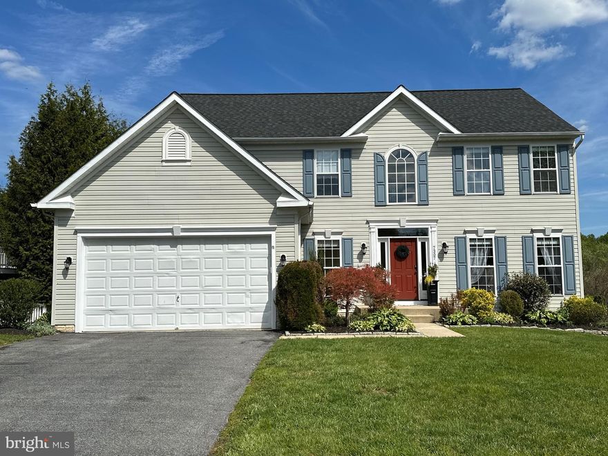 This Victoria Model Colonial-style home in Jenna Estates offers a perfect blend of modern living and natural beauty. With 2,673 sq. ft well designed open plan space, this residence features five spacious bedrooms and two and a half bathrooms, making it ideal for both relaxation and entertaining. Step inside to  an inviting open floor plan that seamlessly connects the gourmet kitchen to the living and dining areas. The kitchen is equipped with high-quality appliances, including dishwasher, electric oven/range, microwave, and refrigerator, ensuring that culinary enthusiasts have everything they need at their fingertips. Elegant crown moldings and window treatments enhance the interior, while the breakfast area provides a cozy spot for morning meals. The primary suite boasts a en-suite bath offering a private retreat for unwinding after a long day. Additional interior highlights include a fully finished basement with an outside entrance, providing ample space for recreation or additional living area and new Roof as well as a peaceful back Screened Deck to take  the protected treescapes. This lovely property sits on a generous 0.25-acre lot that back to the tranquility of nature from the rear screened porch, perfect for outdoor gatherings or quiet evenings. The attached two-car garage with a front entry and garage door opener adds convenience and security. The community is conveniently located near local shopping, dining, and recreational options, including Liberty Reservoir, Turf Valley and Paptasco State Park,  ensuring that all your needs are just a short drive away. This home combines comfort, style, and a prime location, making it a must-see for anyone looking to enjoy the best of residential living. Don't miss the opportunity to make this beautiful property your own!