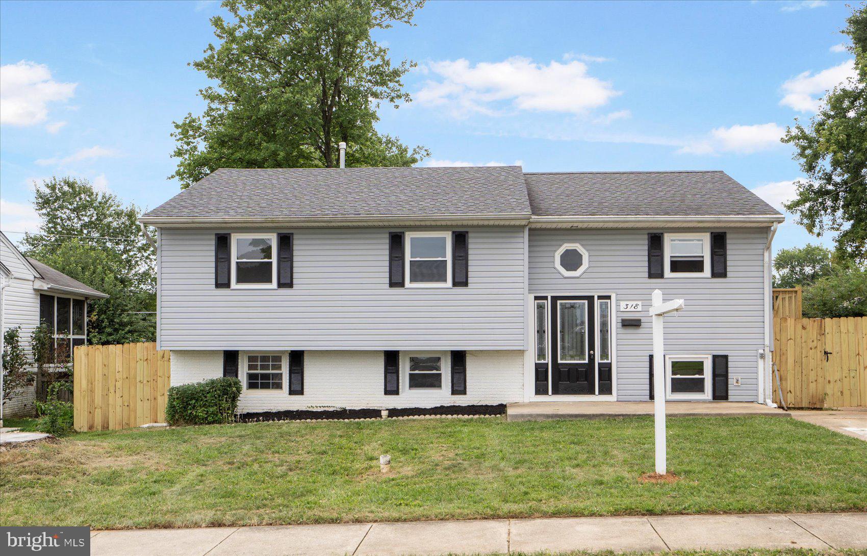 Don't miss this updated gem! Move in ready home with bonus spaces! This four bedroom two bath house is ready to welcome you home. Enjoy your granite countertops in your updated kitchen with stainless steel appliances. Drink your coffee or tea in the screened in sunroom attached to the dining room. Lots of sunlight with new windows in the living room. Fresh new carpeting throughout. Upstairs bath is has been freshened up. The basement offers a large bedroom , family room and full bathroom with shower. There is also a separate room for the washer and dryer. Enjoy your privacy in the fully fenced in back yard ready to make it your own.