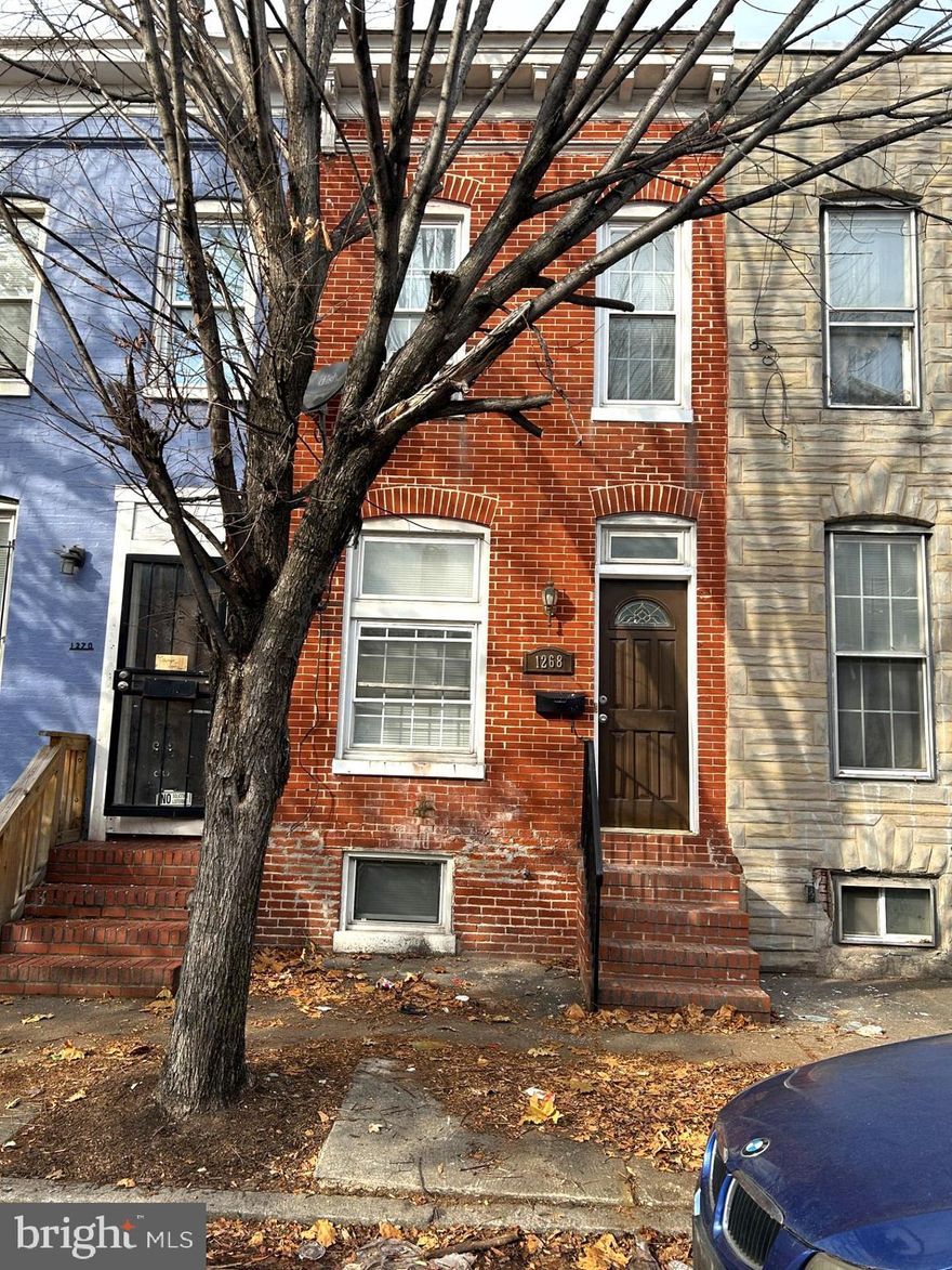 All brick two bedroom and 2.5 bath townhouse in Pigtowns' Main Street Corridor, close to Carroll Park and the golf course.  Enjoy the Annual Pigtown Races and Festival!  Walk to the stadiums, each about a mile away or less.  Hardwood floors, recessed lighting and granite counters greet you in this bright remodel.  Washer and dryer are stacked and located in the half bath on the main level for your convenience. Half of the basement is finished with carpeting and recessed lighting.  The rest of the basement can be used as extra storage space.  Two decent sized bedrooms are on the top floor with two full bathrooms and a skylight.  The backyard is fully fenced.  First time home buyers might want to check with the Buy Back the Block programs available for help with closing costs, grants/loans.  For the investor, home has been lead paint tested, and rental licensed inspected and approved through the city.