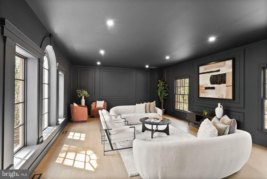 Wow—where do you start? This classic Great Falls estate has been completely reimagined and renovated with top‑of‑the‑line finishes and carefully curated design that fuses modern elegance with everyday function. Set on a serene, wooded 5‑acre lot, the nearly 7,000 sq ft of living space is move‑in ready and offers something for everyone. The main level showcases a gourmet chef’s kitchen with a 12' attached pantry, designer induction dual oven, striking hood, two dishwashers and a Cafe Series refrigerator—ample room to cook and entertain. The kitchen opens to a beautifully designed wet bar with custom Cafe beverage drawers and to a dramatic brick‑front hearth with wood‑burning fireplace that frames views of the private backyard. Seamless indoor‑outdoor living is perfected by the new main‑level deck, while the open living and dining rooms balance everyday comfort with the grace to host the most lavish affairs. The main‑level Great Room is an inspiring retreat, finished with custom moldings and abundant windows that flood the space with natural light. This exceptional property blends refined finishes, smart layout and peaceful acreage to create a rare Great Falls opportunity.