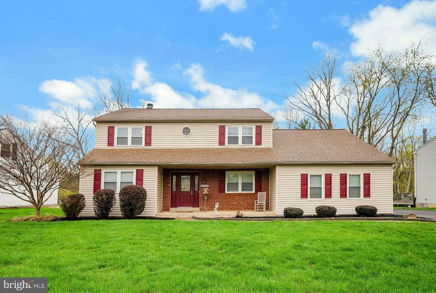 Welcome to this beautifully maintained 4-bedroom, 2.5-bath custom Colonial nestled on a gorgeous, private lot in highly desirable Upper Dublin Township. This is the only home in the community featuring a side-entry 2-car garage—just one of the many custom details that make this property truly special. Step into the welcoming foyer with tile flooring, flanked by a formal living room—perfect as a home office—and a formal dining room featuring hardwood floors, crown molding, and chair rail, ideal for holiday gatherings and family dinners. The updated kitchen will delight the chef in the family with its abundance of cabinets, quartz countertops, tile backsplash, plank flooring, stainless steel appliances, pantry closet, and a triple window that fills the space with natural light. The adjoining family room boasts a custom fireplace with marble surround and French doors leading to a large deck—perfect for relaxing or entertaining while overlooking the yard with views of the woods.  A spacious laundry/mudroom offers excellent storage, room for cubbies, and access to both the garage and rear yard. A recently updated powder room completes the main level. Upstairs, the primary suite is a peaceful retreat with a luxurious en-suite bath featuring a large, tiled stall shower and marble-top vanity. Two additional bedrooms are generously sized, and the fourth bedroom is enormous, complete with an adjoining flex room—ideal for a second home office, playroom, or a future walk-in closet. You'll also find under-eaves storage for all your seasonal items. The finished basement is made for entertaining with a large recreation room and built-in bar area—perfect for hosting game nights or casual gatherings. This exceptional property backs to woods for ultimate privacy and is just minutes from top-rated schools, parks, swim and country clubs, shopping, dining, public transportation, and the PA Turnpike. Lovingly maintained by the original owner, this home is truly move-in ready and waiting for its next chapter. Don’t miss your opportunity—schedule your showing today!