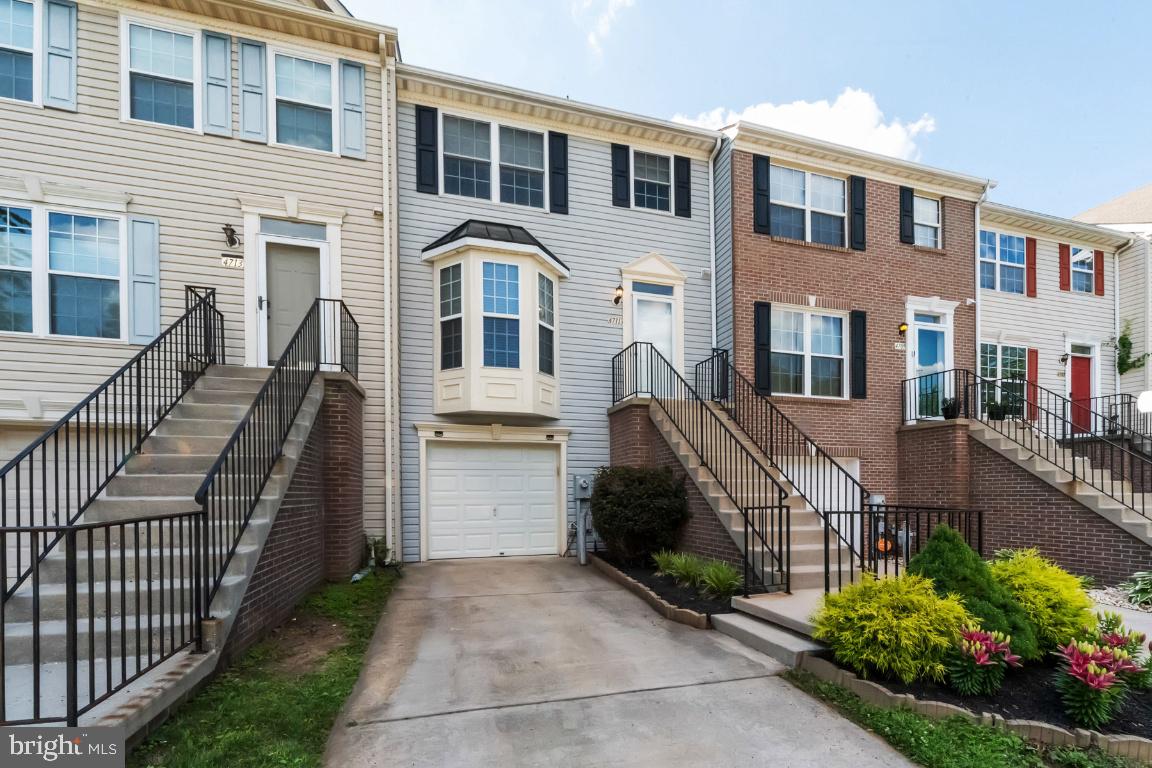Welcome home to this 3 bed, 2.5 bath garage townhome in NewTown, with updates ready for its new homeowner! The main level features an open kitchen with granite countertops and an eat-in nook perfect for a breakfast table; a convenient main level powder room, hard woods running throughout, a spacious combination dining and living room, and sliders to the deck and fenced backyard. On the upper level, the master bedroom is a generous size with a walk-in closet and dual entry bathroom. Two additional bedrooms can be found down the hall. Downstairs features an additional living space, 2nd full bathroom, laundry/utility room and access to the 1 car garage. Updates include fresh paint throughout, HVAC (2020), water heater (2018). Enjoy the amenities of NewTown including a low HOA, community pools, playgrounds, walking paths, tennis courts, dog park, and walkability to schools and shopping.
