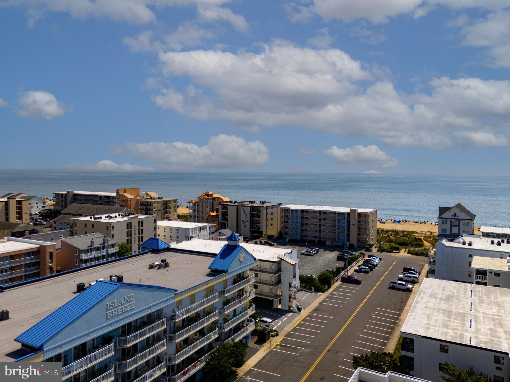 Expansive 4-Bedroom Condo with Ocean Views in Island Breeze – Rarely Available!
Welcome to one of Ocean City's most spacious and well-appointed condos — a 2,570 sq ft, 4-bedroom, 3 full-bath gem located in the sought-after Island Breeze Condominiums, just steps from the 138th Street beach. With ocean views and a prime Ocean Block location near the Delaware and Fenwick Island border, this bright and beautifully updated unit offers coastal living at its finest.
Rarely available and boasting the 5th largest square footage of all currently active Ocean City condos, this oversized floor plan hasn't been offered in Island Breeze for over two years. Inside, you’ll find a light-filled, open-concept living space with recent upgrades including:
✔️ 2024 Tankless Hot Water Heater
✔️ 2024 HVAC system
✔️ Updated Primary Bath shower
✔️ Newer stainless steel refrigerator and dishwasher
✔️ Luxury vinyl plank flooring in the living room
The wide entry hall opens into a chef-friendly kitchen with granite countertops and a breakfast bar, flowing seamlessly into spacious dining areas—ideal for hosting or casual gatherings. The oversized living room features crown molding, a cozy gas fireplace, and access to the expansive 37-ft balcony, which offers an east-facing view of the Atlantic Ocean and is also accessible from the primary suite and second bedroom.
Two of the four bedrooms include en suite baths, while the remaining two share the third full bath—perfect for hosting guests or large families.
Additional features include a private community swimming pool and sun deck, covered parking, secured building entry, and the option for buyers to purchase fully furnished—or the seller is happy to remove furnishings if preferred.
Located in the quieter northern end of Ocean City, this is a rare opportunity to own a high-end, move-in-ready beach retreat with the space of a single-family home—just seconds from the sand.