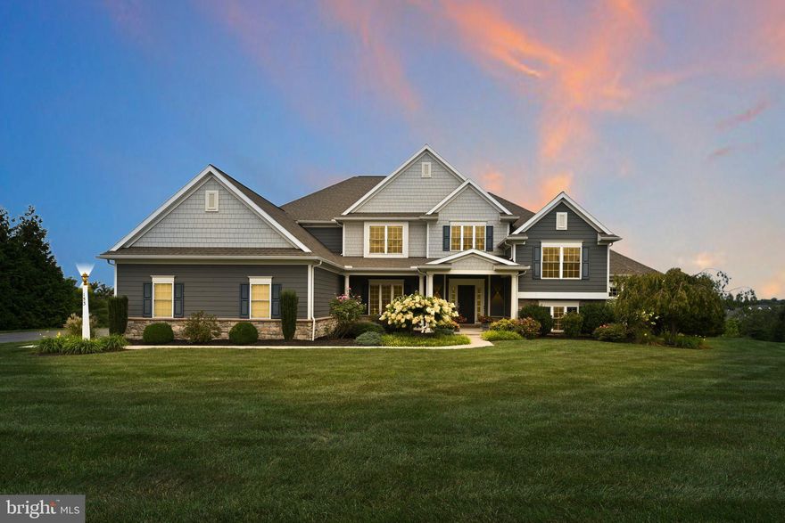 Beautiful Willow Creek Farms home with great features and amenities! Upon entry, there are beautiful sightlines throughout the first floor, a two-story ceiling with a catwalk, and two closets for storage. Adjacent formal dining room with continued hardwood floors, chair rail, and crown molding. Large two-story living room with natural sunlight and a stone fireplace. Spacious kitchen with granite countertops, large island, farmhouse sink, stainless steel appliances with seating room, and eat-in areas with access to rear deck. Mudroom off of 3 car garage with adjacent laundry room. The main level primary suite is fully equipped with a tray ceiling, seating area, double vanity sinks, soaking tub, and tile shower. Upper-level loft overlooking the living room and front entry and 4 additional bedrooms with 2 full bathrooms. The walkout lower level offers a large game room with a kitchenette, an additional full bathroom and a carpeted family room. This home offers 2 spacious offices, perfect for those who work from home. The rear outdoor patio with a built-in firepit and screened-in area is accessed from the lower-level sliding doors. Expansive rear yard. Served by Lower Dauphin School District. Offers a great location near all Hershey Amenities. HOA covers common area maintenance. Schedule your showing today!