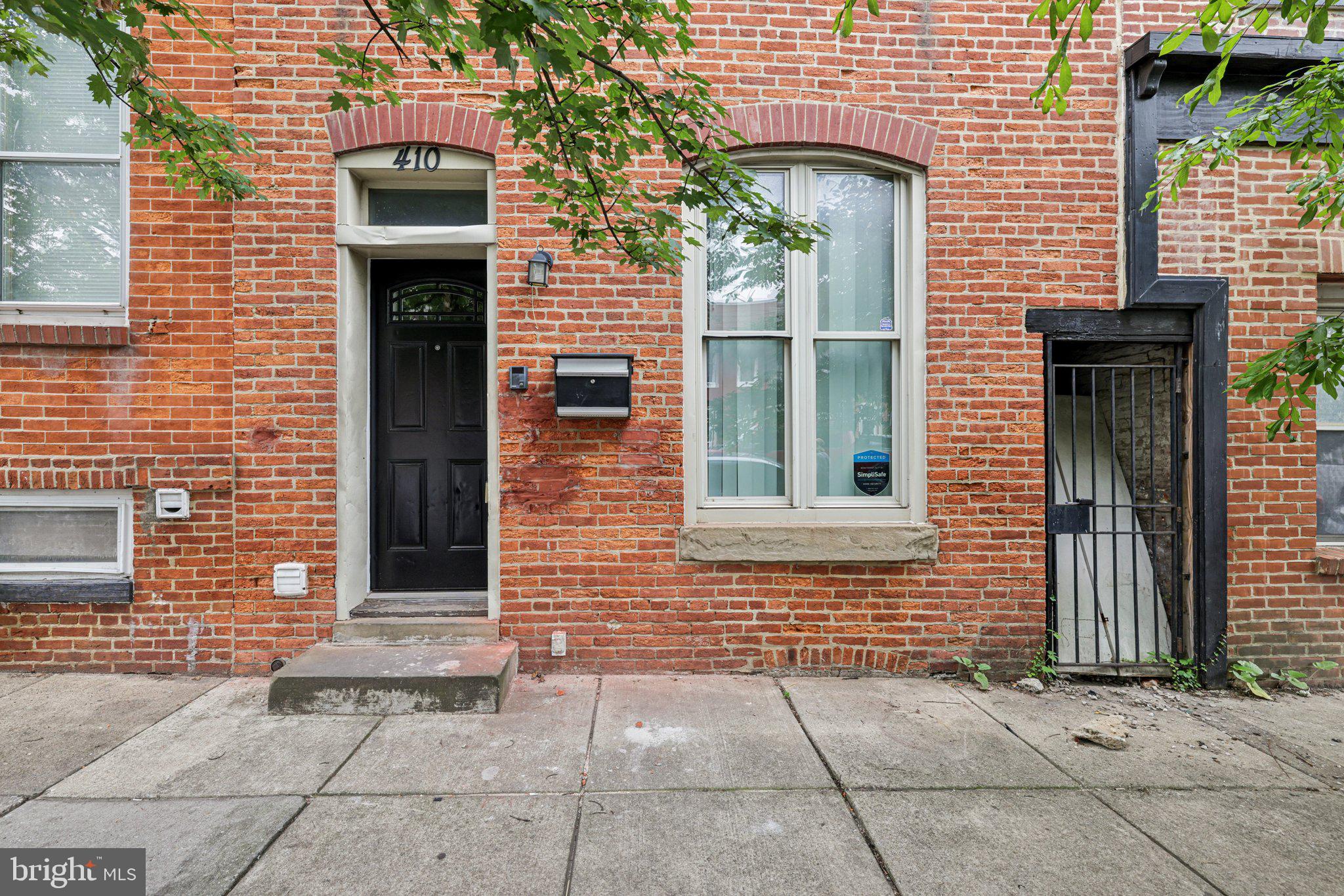 Charming 2 bedroom 1.5 bath townhome with exposed brick walls scattered throughout. Open concept main level has lovely hardwood floors. Kitchen has S.S. appliances and granite countertops with access to backyard. Unique iron staircase leads to 2 bedrooms on upper level and 1 full bath. Half bath also on main level. Basement is unfinished. Close to Patterson Park, Johns Hopkins, Fells Point, Canton and more. Must see!!!