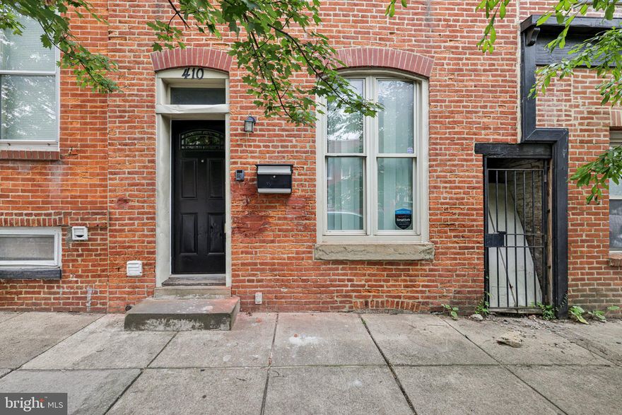 Charming 2 bedroom 1.5 bath townhome with exposed brick walls scattered throughout. Open concept main level has lovely hardwood floors. Kitchen has S.S. appliances and granite countertops with access to backyard. Unique iron staircase leads to 2 bedrooms on upper level and 1 full bath. Half bath also on main level. Basement is unfinished. Close to Patterson Park, Johns Hopkins, Fells Point, Canton and more. Must see!!!