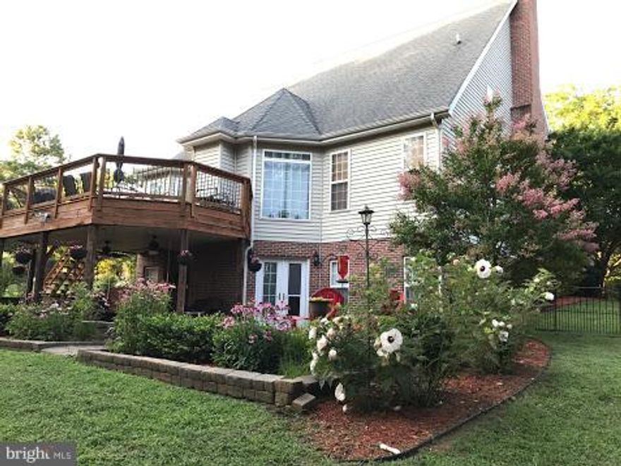 BACK ON MARKET.   BUYER FINANCING FELL THROUGH. Custom Colonial on just over 2 acres!  4408 fin sq ft.  All bedrms w/priv baths, Kit w/ceramic tile & upgraded cabinets, stainless appliances, breakfast rm, formal liv rm w/wood fp, & formal din rm.  Wet bar off kit & fam rm w/gas fp.  Fin basement w/bdrm, full bath, storage & workout room.  Deck, porches, patio, fire pit, fenced yard,