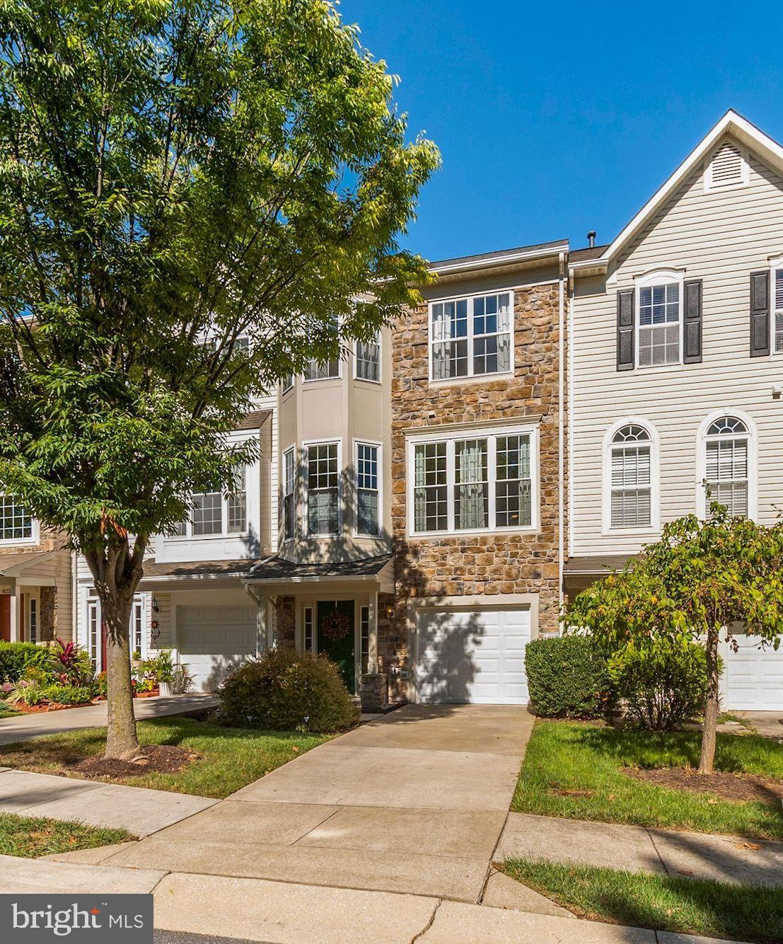 Welcome Home! This spacious and bright three level luxury townhome in the highly desirable Russett neighborhood will have you feeling at home. The floor plan offers the space and details of single-family living with the convenience of a townhome. Beautiful property that has tons of curb appeal with its attractive stone front. The entry level of the home features an inviting natural light foyer with access to the attached garage. This level offers spacious recreation room with half bath, laundry, sliding glass door to the deck/yard/common green space. The main level of the home features a huge open space with powder room, living room, spacious eat-in kitchen with tons of cabinetry, as well as a separate area for more formal dining and living with bay window. The upper bedroom level features a very large owner's suite with walk in closet and private bathroom with soaking tub and separate shower. On this level there are two additional bedrooms which share full bathroom. The roof, water heater, stove and dishwasher are new. The property is located close to grocery, restaurants, shops, Walmart, Sam's Club, Target, public transportation and major commuter options. Community amenities include pools with bathhouse, tennis courts, tot lots, hiker/biker trails, basketball court, volleyball area, picnic pavilions, and much more. Lastly, nothing like being able to enjoy your home while the yard is routinely manicured by the home association!