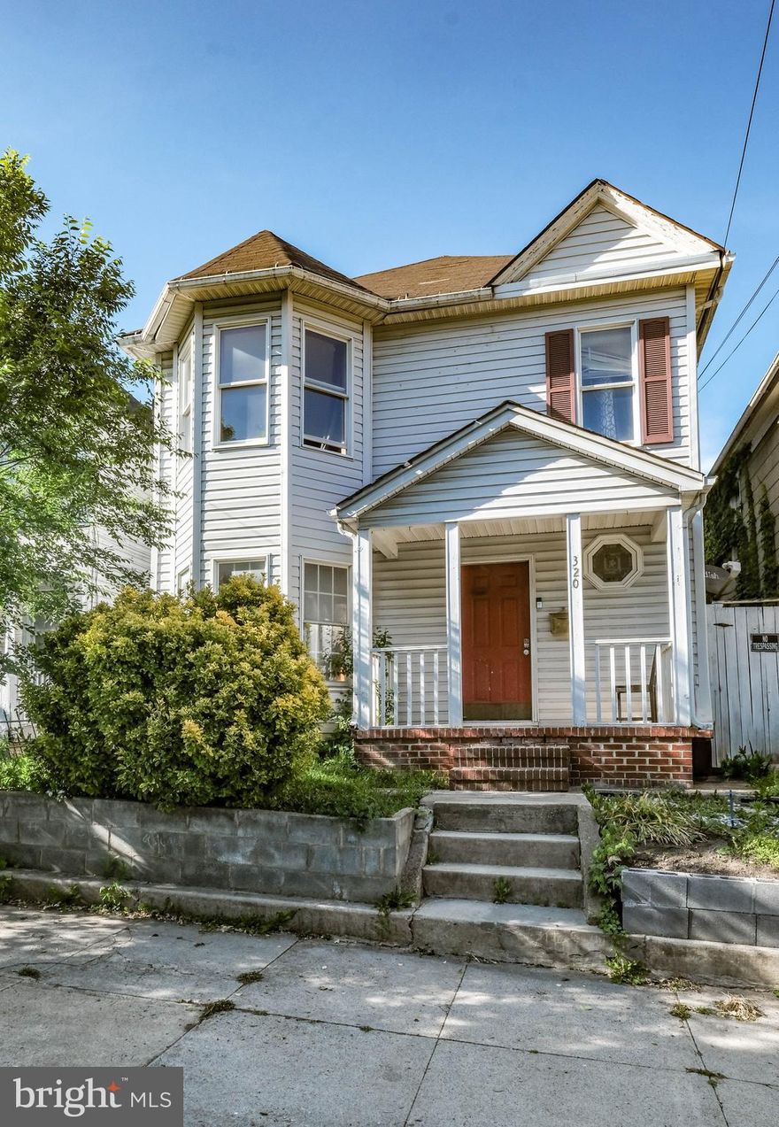 Motivated Seller!  Great Property Under $250,000! In the heart of the city of martinsburg, stands this vintage colonial, 3  bedrooms and 2 full bath.  Unique traditional syle  layout boasts high ceilings with large  17x 12 living room , bay window, with brick front gas fireplace, gorgeous mantel and decorative bookshelves.  Just off the of the living room is a formal dining space with orginal hardwood flooring. Moving into the kitchen area, high ceilings, stove, refrigerator, vinyl flooring. The main level also includes an addition room just off of the dining room as a bedroom or office space and a large laundry area with another full, renovated bathroom. The upper level includes 3 bedrooms and 1 updated bathroom. The exterior back of the home has a deck, storage shed and place to park. The seller has put some improments in this home to include: New gas furnace for the downstairs level, downstairs bathroom completely replaced, dining room painted, upstairs plumbing/tub/toilet/tile redone and all of the carpet in the main and upper level is new as of 5/15/2025! Commuter routes and bus stops within 1 mile of home, Marc Train {martinsburg} minutes from this location, parks, downtown restaurants within walking distance! Agents see documents in Bright.