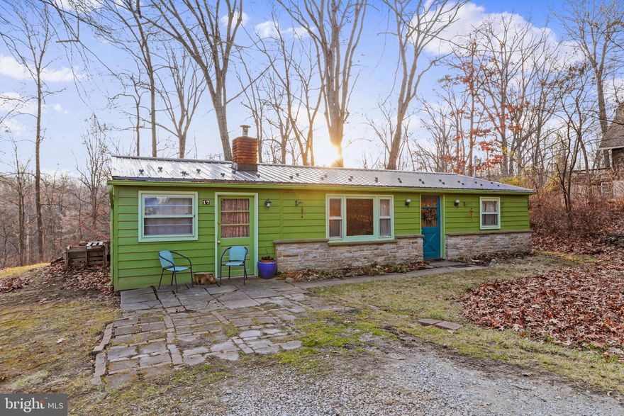 Adorable cabin in the woods! This house has been repainted and resealed on the entire exterior with a new metal roof. Nice rear deck to enjoy the peace and quiet. Two older outside sheds. Woodstove insert included. Come and make this your own!