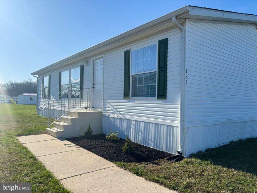 Step into a freshly renovated home designed for comfort, style, and easy living. Every detail has been updated to offer a clean, modern feel from the moment you walk in. This 3-bedroom, 2-bath home is move‑in ready and features new lighting, new drywall, and fresh interior paint throughout. Brand‑new flooring adds a crisp, updated look to every room. Both bathrooms include new vanities for a refreshed and functional finish. The home also includes a new washer and dryer. The kitchen is fully equipped with stainless steel appliances, including a stove, exhaust fan, refrigerator, sink, and dishwasher. A thoughtfully updated home offering a clean and modern living experience. Park approval is required prior to purchase (credit, background, and income verification).Lot rent is $700month. Schedule your showing to