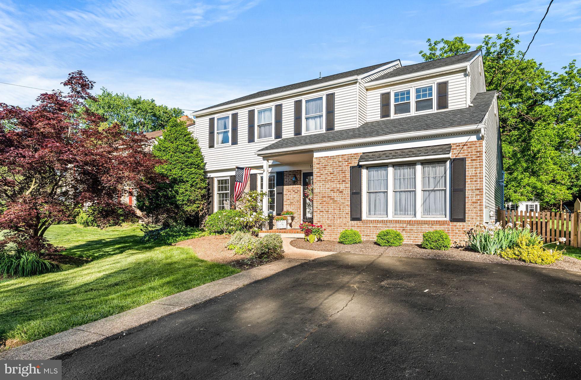 Welcome to 14 Auchy Rd, a stunningly updated center hall colonial home situated on a picturesque half-acre lot in one of Erdenheim’s most desirable neighborhoods. The moment you step from the charming front patio into the bright foyer, you'll immediately notice the thoughtful upgrades and care that have gone into enhancing this home. Crisp trim work, fresh paint, and brand new hardwood floors will be found throughout the main level of this home. To the left of the foyer, glass-paneled French doors lead into a sun-drenched living room—perfect for relaxing or hosting. Flowing effortlessly from here is the formal dining room, which opens onto a covered porch, ideal for outdoor dining and seamless indoor-outdoor living. The completely renovated eat-in kitchen features custom glass-front cabinetry, sleek stainless steel appliances, quartz counters, and plenty of table space for casual dining. Stepping down into the spacious family room, you will be greeted with a newly installed gas fireplace and ample room for entertaining or cozy nights in. A first-floor laundry room and separate half bath add everyday convenience to this thoughtful layout. Upstairs, plush new carpeting extends throughout the second level. The generous primary suite boasts a walk-in closet and private ensuite bathroom with a newly renovated tiled shower. Three additional bedrooms—each with sizable closets—share a well-appointed full hall bath. Stepping outside, this property is complete with a covered porch and a classic brick patio overlooking the expansive, fully fenced backyard—ideal for entertaining, playing, or simply relaxing in your serene surroundings. This home is located just steps from Cisco Park and Hillcrest Pond, and minutes to the Morris Arboretum, top-rated Springfield Township Schools, as well as the shops and restaurants of Erdenheim, Flourtown, and Chestnut Hill. Additional highlights include a brand-new roof and HVAC system, making this home truly move-in ready. Don’t miss the opportunity to own this exceptional home in an unbeatable location!