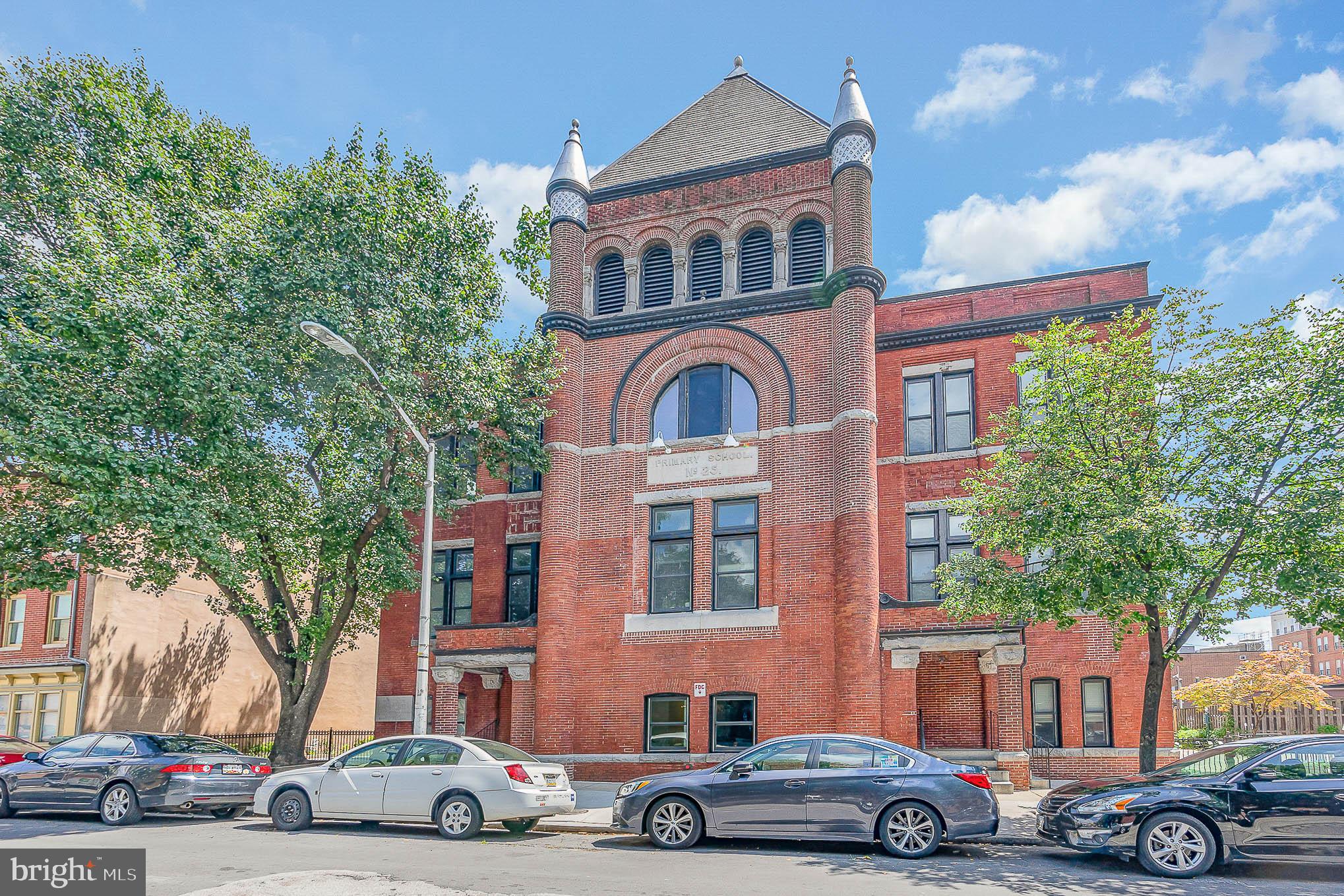 Most beautiful unit in a Baltimore landmark in the heart of Fells Point. Public school N 25 is a historic late Victorian brick structure with an imposing Romanesque tower. Unit 102 is facing the back of the building, providing character, cool urban views, no street noise and plenty of sunshine ! This unit offers a newer stylish kitchen with stainless steel appliances, and an updated bathroom . Hot location! Situated around the corner from Broadway Market, a couple of blocks to Harbor East attractions and from Fells Point waterfront.
Pets are allowed, and the fenced patios are ideal to walk your furry friends.
