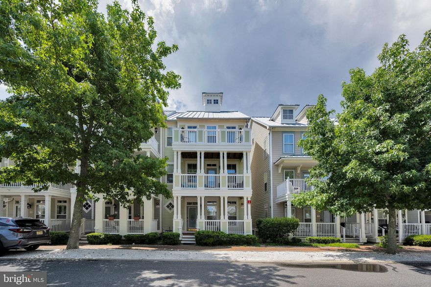 Welcome to 29 Sunset Island Drive - Nestled in the desirable Sunset Island community of Ocean City, this spacious, well-maintained townhome offers an ideal combination of comfort, convenience, and coastal charm.  Just a short stroll from the water, this is the largest NV Homes model available in the community and features peaceful canal views and easy access to the bay.  Spread out across four levels, this home offers 4 bedrooms, 4.5 bathrooms, and a versatile loft with a queen bed and sitting area—perfect for family, friends, or extra guest space.  On the first floor, you’ll find a private bedroom, full bath, laundry room, and a two-car garage—great for storing bikes, beach gear, or extra parking.  The main level is ideal for relaxing or entertaining, with two cozy living areas, a dining room, and a fully equipped kitchen. There's even a game table area for cards or board games after a fun day at the beach.  Upstairs, the third floor includes a comfortable primary suite with its own bathroom, plus two additional bedrooms that share a full bath.  The top-floor loft offers a quiet retreat with its own full bath and lounge area.  Enjoy your morning coffee or evening drink on one of the multiple private balconies, or simply take in the breeze and views that make Sunset Island so special.  Living here means enjoying access to great amenities, including indoor and outdoor pools, a fitness center, private beaches, scenic walking paths, and more—all within a welcoming, gated community.  Spend your summer in style at Sunset Island—one of Ocean City’s most beloved and vibrant waterfront communities.