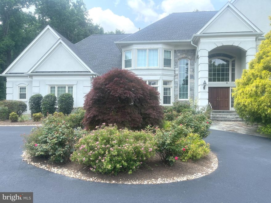 Spectacular Colonial set like a jewel on a slight slope. Gourmet kitchen with granite counters, gas cooking, double wall oven, large pantry,  center island  with breakfast bar and  separate breakfast space.  Walks out to deck with views of pool and trees.  Light filled 2 story foyer and great room with fireplace.   Separate Dining and Living Room with fireplace and study with built ins on ML.  2 powder rooms on ML.  Spacious primary bedroom suite with 3 additional bedrooms  and 2 full baths on UL. Magnificent walk out LL with fireplace is fully finished with recreation room, media room, billiard's room, other room for gym,  lovely bedroom, and full bath.  Pool in back yard brings joy for young & old alike.  Large patio for entertaining. Fantastic private 2 acre lot backs to wooded splendor which emphasizes the quietude of the home.    3 car garage. Langley High School.  Wonderful home for entertaining and living! Appointment Only, call listing agent.