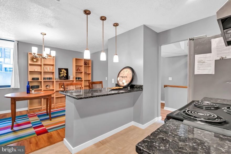 **Seller has accepted a 'Sight Unseen' Offer with Inspection Contingencies** As such, the property is Active / Under Contract and accepting back up offers only. 

Find your way home to the Coldspring Newtown Community. Nestled just west of the Jones Falls, this community boasts private gardens that surround the Ruscombe Mansion.  The Brutalist Architecture of Moshe Safdie's "Coldspring 1B" is in stunning juxtoposition to the green backdrop of Druid Hill Park, and Cylburn Arboretum grounds.  Inside the Flax Terrace development, you will notice private courtyards for the residents and their guests. All of the main entrances are accessed through these courtyards by guests from their ample street parking, while you pull into your covered parking space conveniently located underneath! The Unit's reserved parking space opens to a Mud Room with a convenient closet, and Laundry / Utility room. Throw your scrubs / yoga / gardening gear right in the laundry on your way to cook dinner! Once up the stairs on the main level, the Eat In Kitchen / Breakfast Nook and Half Bath are at the landing. The Modern Open Tread Stairs tease the eye with a glimpse of the back garden through the Great Room / Family Room. A great space for hosting game night, book club, or birding adventures. At the top of the stairs is a skylight that lights the hallway to the Primary Suite with an Ensuite Full Bath, and Two Bedrooms served by One Full Bath. The high ceilings in Primary Suite boasts Transom Windows to let the light drift in to nourish the plants in your own personal oasis. Looking forward to showing you around what residents call a "Hidden Gem"!