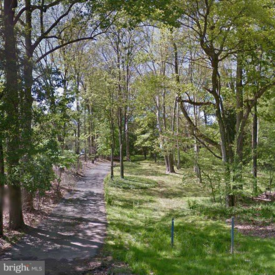 Beautiful 2 acre lot set up on a hill with private treed frontage on glen mill road and cleared rear yard. Currently a house to be torn down. Public water and electric at site. Septic approved for 6 bed house. Two acre lot for sale behind property for 695k. Buy both for a fabulous 4 acre parcel in Potomac!