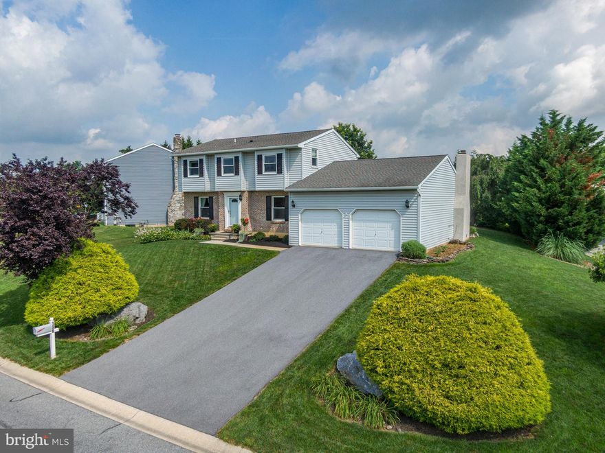 Welcome to this meticulously maintained 2-story home in the desirable Fleetwood School District. Offering over 2,100 square feet of thoughtfully updated living space, this 4-bedroom, 2.5-bath home is truly move-in ready and shows with pride of ownership at every turn. The gorgeous, updated kitchen is a true highlight of this home and includes updated electric, custom cherry cabinets, newer appliances and granite counters. The range is brand new in 2025. Lovely tile backsplash and ample counter space. There is also a spot to house a wine fridge. The quality of the cherry cabinets is unsurpassed and the overall design and decor is awesome. As you approach and enter this home you will notice the attention to detail with the beautiful landscaping. From the foyer you're greeted by a bright dining room with wood floors as well as a spacious living room that features a stunning custom wood wet-bar, crown molding and pretty soffit lighting - a nice feature that sets this home apart. Convenient 1st floor powder room. Off of the kitchen is the family room that also has had many updates. The floor to ceiling stone wall at the gas fireplace and new gas insert is stunning.   The mantle is wired for electric for ease in holiday decorating. It's finished off with durable Luxury Vinyl Plank flooring and recessed lighting. A super cozy room that is decorated perfectly. This leads out to the rear patio and huge flat yard. The covered patio is an oasis for relaxation and is adjacent to the hot tub. Hop in and enjoy! All of this sits on a huge corner lot with an extra driveway in the rear for more convenient off-street parking. So, in addition to the 2 car garage and large driveway in the front you have a ton more space for guests, etc. Very private! Large shed that is new in 2023.  The second floor continues the theme of updating and quality finishes. Four generous bright bedrooms, most with hardwood flooring. The cute hall bath was updated in 2024. The primary suite is gorgeous and inviting. A large room with oak flooring and ample closet space. You will love the color as well as the cozy window seat! The en-suite bath was updated to include tile and a beautiful glass shower.  There is a cool pocket door separating the bedroom and bath.  The wall holding the pocket door is reinforced so that a TV can be mounted. The crown molding in the owner's suite and living room is a classy touch. Large basement with ample storage plus a pull down stairwell in the garage for even more. 

Major updates give you peace of mind: Incoming water line proactively replaced in 2025,  roof replaced in 2014, windows replaced, stucco on both chimneys redone in 2025, plus numerous additional improvements throughout the years. This is the immaculate, turnkey home you've been waiting for. Clearly the owners have decided that maintaining this home in top condition was a priority. You will be the beneficiary and all you have to do is move in and enjoy!