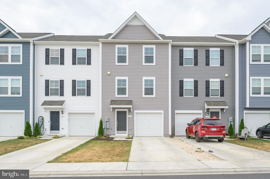 Move-In Ready & Priced to Sell!
Welcome to 14 Colchester Court in McCauley Crossing, Bunker Hill! Built in 2023, this like-new townhome offers 3 bedrooms, 2 full baths, 1 half bath, and 3 levels of living space. The lower level includes garage access, utilities, backyard entry, and an unfinished rec room with bathroom rough-in, ready for your finishing touches. The main level features an open floor plan with natural light, a stunning kitchen with quartz countertops, stainless steel appliances, pantry, and oversized island. Upstairs, the spacious primary suite with walk-in closet & en-suite bath is complemented by two additional bedrooms, full bath, and upper-level laundry. Attached garage, paved driveway, and guest parking add convenience, while the backyard is a blank canvas for you to make your own. Minutes to Inwood, I-81, and the VA border, this home is the perfect mix of comfort and convenience. Don’t miss it, schedule your showing today!