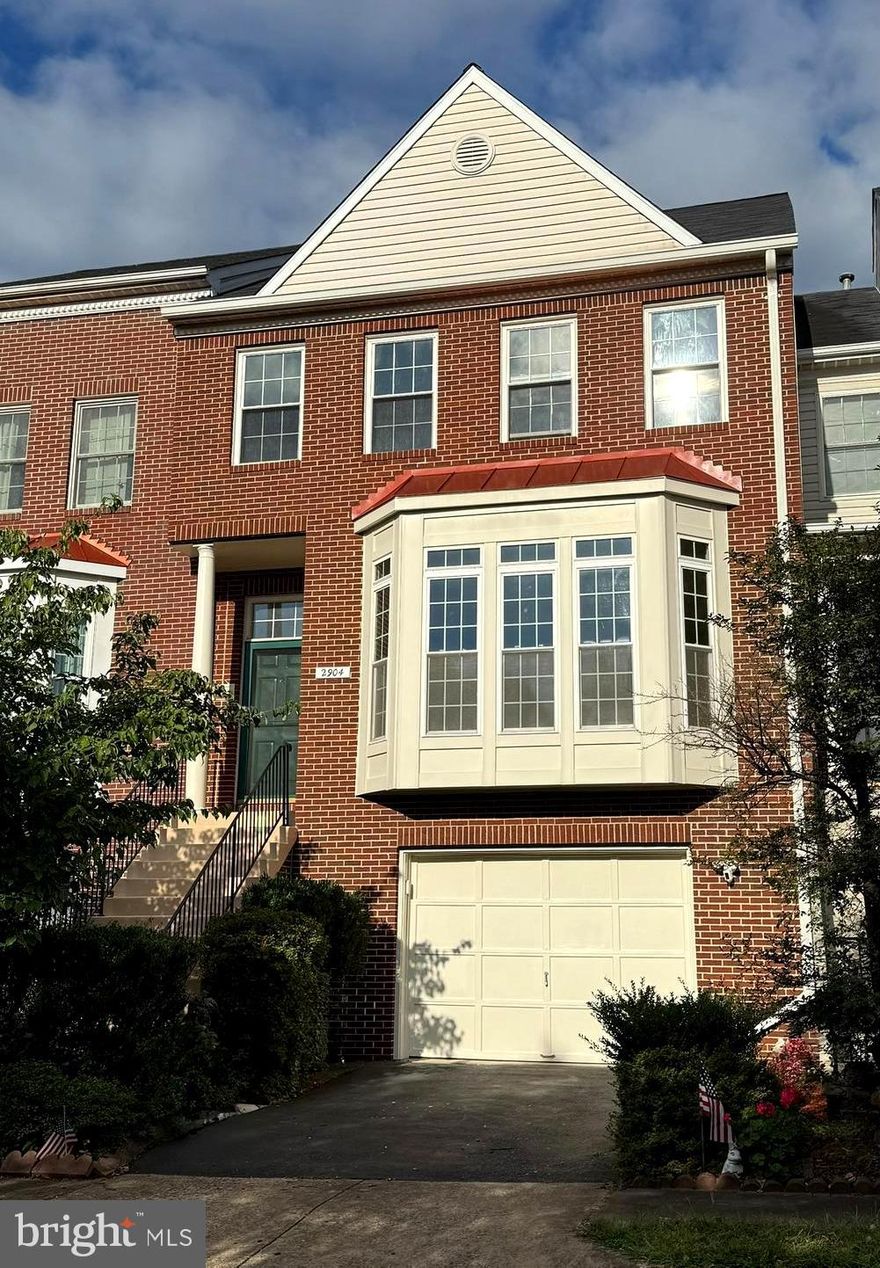 Welcome to this beautifully maintained and thoughtfully upgraded 3-bedroom, 2 full- and 2 half-bath townhome in Barkley—one of Fairfax’s most desirable communities. Filled with natural light and elegant finishes, this inviting home blends warmth, comfort, and functionality with stylish everyday living. The main level features soaring ceilings and LVP floors that create a cohesive, polished flow. At the heart of the home, the kitchen showcases 42-inch solid wood cabinetry, quartz countertops, brand new stainless appliances, and a cozy gas fireplace—perfect for gathering. A private deck extends your living space outdoors.  A remote controlled Sunsetter shade makes enjoying your deck ideal for morning coffee, sunset relaxation, or weekend entertaining. The separate dining room, powder room, and spacious family room make this level well-suited for both large gatherings and intimate evenings at home.  Upstairs, the primary suite is a true retreat with high ceilings, room for a king-sized bed, walk-in closet, and a spa-like ensuite with soaking tub, dual-sink vanity, linen closet, and a separate glass-enclosed shower. Two additional bedrooms, a hall full bath, and a linen closet complete this level, offering privacy and comfort for everyone. The lower walk-out level adds even more flexibility with a recroom—perfect for a home theater, gym, or game room—along with a second half bath, laundry, and storage. Step outside to the covered patio, garden, yard, and oversized garage with additional storage.  The Barkley community offers wide streets and sidewalks, tennis courts, a playground, trails, and grassy areas for recreation, plus social events throughout the year. Per seller, recent updates include: LVP in Dining room, Living room, all baths 2025; Carpet Lower & Upper Levels 2025; fresh paint 2025; all kitchen appliances 2025; Quartz countertops.  New lights 2025, HWH 2021, AC 2011, Roof 2016, Windows 2016.  The location is unbeatable—just a mile to Mosaic District, close to Harris Teeter, Safeway, MicroCenter, Tysons, Vienna, Oakton, and county parks and trails. Commuters will appreciate nearby Vienna and Dunn Loring Metro Stations, plus easy access to Routes 29, 50, 66, and 495.  This home and location are true standouts in Fairfax—and could be yours!