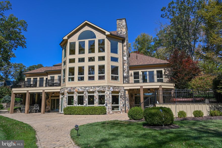 A magnificent waterfront retreat in The Reserve at Holy Cross on the shores of Deep Creek Lake, representing the pinnacle of lake life living. This incomparable estate captures the essence of refined waterfront with a private dock, expansive outdoor entertaining spaces, and tranquil lakeside ambiance.  Featuring 7 total bedrooms, 5 of which are en-suites, this home was thoughtfully designed with privacy, comfort, and flexibility in mind. Nature and luxury converge in perfect harmony with beautifully landscaped grounds creating an unmatched backdrop for lakefront gatherings, comfort and peace of mind.