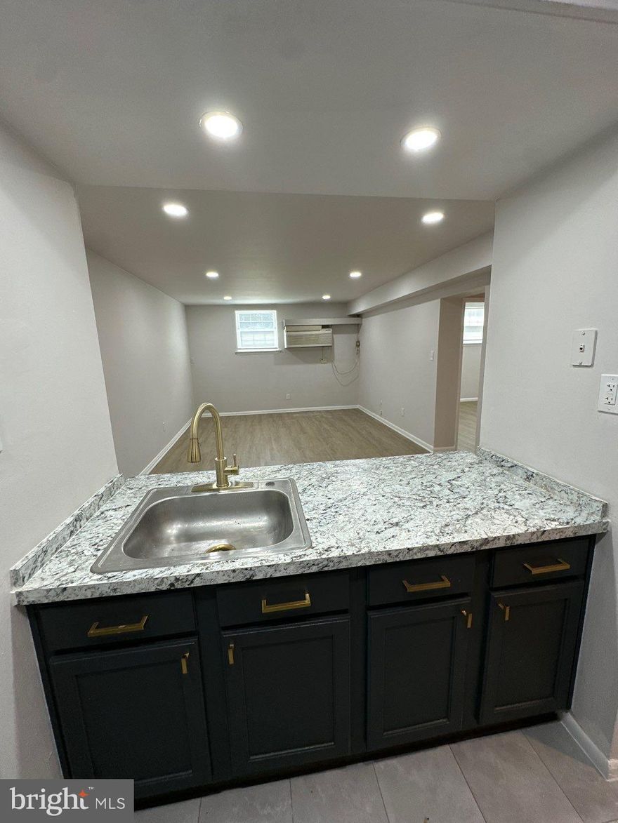 Tastefully updated, spacious , and bright - 2 bedroom, 2 full bath apartment awaits its new resident. Great location on Rhawn within easy walk to Winchester Park, or Frankford Avenue. Apartment has been redone to include solid surface flooring throughout. Kitchen has large island great for dining, but there is also space for a formal dining table. Recessed lighting throughout. Laundry room on site. Owner pays cold and hot water, sewer, trash.