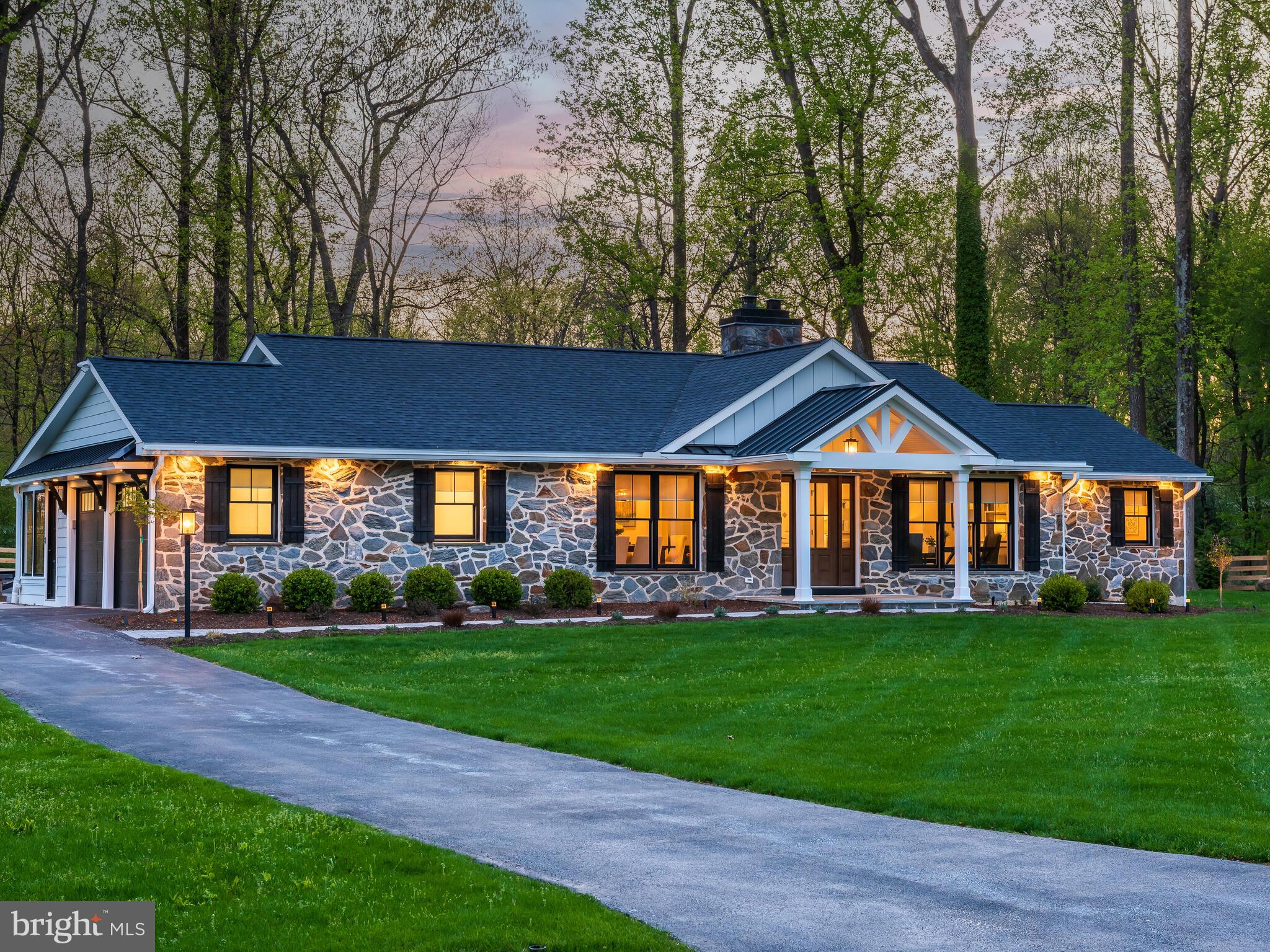 Welcome to 1512 Ashby Road in Paoli, a magnificent, completely renovated, light-filled 3-bedroom, 2.5-bath home, boasting 2,834 sq ft of modern living space within the Tredyffrin-Easttown School district and across the street from the Mainline YMCA. This exquisite home has been transformed from top to bottom including over $1,000,000 in upgrades, blending top-tier finishes with elegant design to create a sophisticated and comfortable living experience.
The exterior has been completely renovated including all new Hardie board siding, new roof, gutters, soffits with accent lighting, all new energy efficient luxury Anderson windows, brand new doors, new garage doors, ring doorbells and security cameras, new landscaping, stone walkways and a spacious hardscaped patio with an inviting fire pit. All mechanicals have been upgraded to the highest standards including the two zone HVAC system, hot water heater, whole house generator as well as a gorgeous solid stone fireplace boasting additional energy efficiency with an upgraded chimney flue system. PECO installed new underground electrical service so there are no wires to obstruct your view.
The home’s interior has been redesigned and opened up to provide a spacious open floor plan providing natural light and beautiful views of the property from every room in the home. Brand new solid hickory hardwood flooring throughout adds sophistication and elegance. At the heart of the home, the large, dream kitchen has been completely renovated with custom-crafted Goebel wood, soft close cabinets, modern GE Cafe stainless steel appliances including an induction range, beverage/wine refrigerator and more elegant finishes including a 12 foot island adorned with quartz countertops. The high-end finishes and custom cabinetry continue into the mud room that leads to a delightful and light-filled sunroom overlooking the beautiful patio and backyard. The 20x30 oversized family room with vaulted ceilings and two giant walls of windows providing peaceful views of the backyard and patio. All three bathrooms have been completely renovated and beautifully decorated with top of the line finishes. You will find custom closets in each bedroom and thoughtfully designed additional closet/storage space throughout the home.
This completely renovated home, lovingly and originally built in 1964, is packed with numerous other enhancements including all new electrical and plumbing as well as new framing, sheathing, new spray foam insulation, drywall, woodwork and trim. The extensive list of upgrades can be found in the document section. The home sits on just over an acre of land on a beautiful flat lot with lots of space for additional gathering and entertainment space.
1512 Ashby Road is conveniently located near the Berwyn and Daylesford Train Stations as well as the Paoli Shopping Center, Wegmans and Acme. Enjoy easy access to the Turnpike ramp at Rt29, Rt202, Rt422 and RT76. Welcome to your new home!