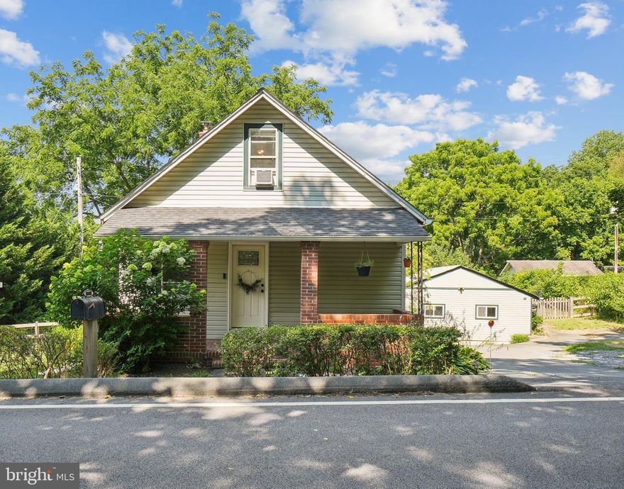 Discover your dream home in a picturesque setting that offers the perfect blend of country tranquility and urban convenience. Near Washington DC and the surrounding suburbs, this charming residence sits on a spacious half-acre lot, backing onto serene woodlands for ultimate privacy.

Explore nearby Little Seneca Lake, perfect for fishing or kayaking adventures. The property boasts delightful outdoor features, including a charming out-building ideal for chickens, a vibrant butterfly garden, and a cozy fire pit for memorable evenings under the stars.

Step inside to find a light-filled, two-bedroom, two-bath home showcasing beautiful hardwood floors across two levels. The inviting breakfast area opens through sliding doors to a deck overlooking the fully fenced, private backyard. The main level offers a versatile bedroom and full bath, perfect for a home office. Upstairs, a spacious bedroom and bathroom with a skylight. There's a convenient main-level laundry room.

Enjoy the benefits of a private well with a UV light system, eliminating the need for city water, and a septic tank. Recent updates include a new HVAC system, roof, and gutters, ensuring peace of mind and comfort.

Come and fall in love with your new home, where country charm meets city convenience!