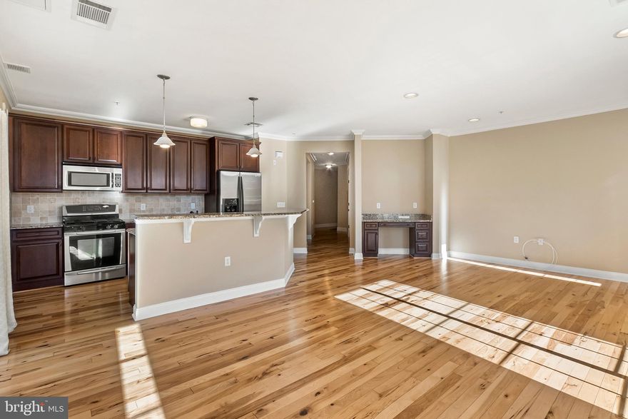 For Rent Immediately:  2 bedroom, 2 bath  condo unit with the most desirable spit floor plan  in The Grandes at Riverview.  Sunny and breezy 2nd floor corner unit  on the quiet river side of the building over-looking the trail.  Upgraded Mifflin model with wood flooring, granite counter-tops in kitchen & baths and stainless steel appliances. Kitchen is open to Great Room with in home office area with built-in desk, two balconies with 3 storage closets. Easy access to elevator, stairway and garage. Two parking spots included ( 51 & 16) in the secure parking garage. Enjoy  free community swimming pool & fitness center. Walk to the train, restaurants and shops of the fashionable town of Conshohocken. Only 20 minutes to Center City Phila.!