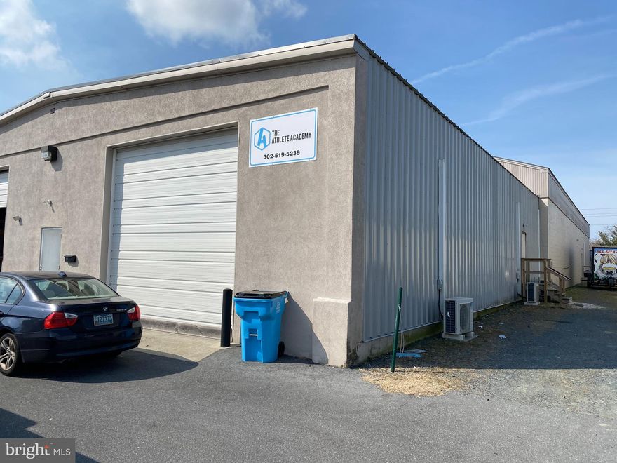 This +/-6600 SF warehouse space offers a unique covered loading dock to allow a truck or trailer to back inside of the building to load into a dock high warehouse out of the weather or overnight. The Warehouse space beyond the dock high entry is approximately 5900 SF. The space also offers a full bath with a shower in the warehouse portion. There is plenty of room to build an office to suit if you need one to go along with your warehouse space. The landlords are open to creative uses for space so come with offers.