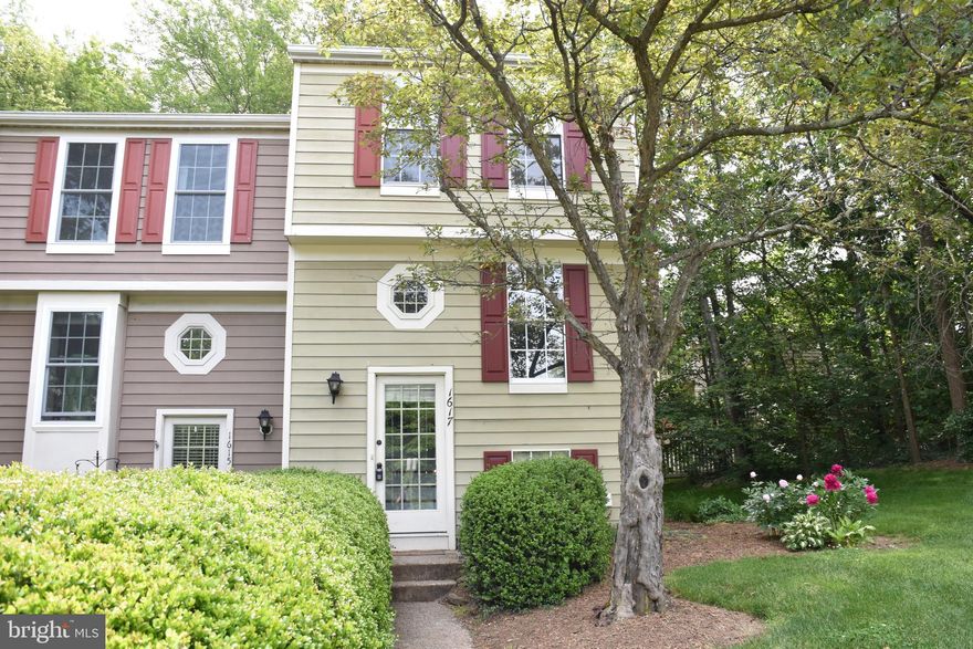 Look no further! Stunning end unit with beautiful brazilian cherry hardwood floors on main level & stairs; fairly new washer and dryer (2 y/o); stainless appliances, open cabinets with glass shelf above breakfast bar; bath with granite/marble floors; mirrors and vanity; cozy wood burning fireplace in walk up lower level family room; deck and patio with private fenced yard; backing to trees. Quiet Thornhill Cluster close to Reston Town Center & Wiehle Metro