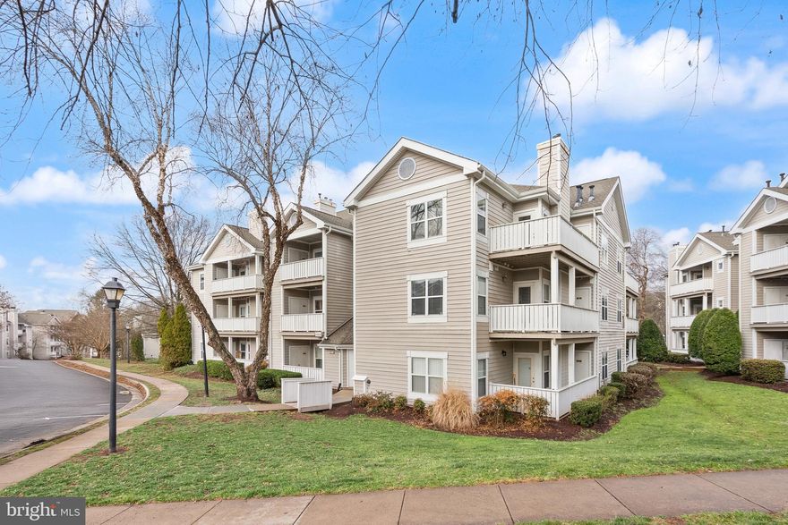 3.375% Assumable VA Loan Available! This updated first floor condo sits just two minutes from Route 29, Route 28, and I-66, which means your morning just got easier. Fresh paint, thoughtful updates, and an open layout make the whole place feel light and easy to live in. The living room centers around a gas fireplace with a marble mantel and flows right into the dining area, perfect for quiet nights or having a few friends over. The kitchen gives you real working space, tons of cabinets, and two separate pantries. Storage will not be your problem here. The primary suite is spacious, with a walk-in closet that already has built-in organization. The second bedroom is flexible, use it as a guest room, home office, workout space, or creative studio. Updates include new water heater (2026), new paint throughout (2026), new carpet in bedrooms (2026), new washer and dryer (2025), new refrigerator (2025). Outside, you get a wraparound covered balcony, a private exterior storage closet, one assigned parking space E31, and plenty of visitor parking for guests. Living in the Sanderling community means access to a pool, clubhouse, exercise room, racquetball courts, walking paths, and a scenic lake. You are also within walking distance to shops, restaurants, Starbucks, and the Cinemark Centreville. Metrobus access is less than a block away, and Dulles International Airport is under 10 miles. If you are looking for low maintenance living in a location that truly works for your day to day life, this one checks the boxes.