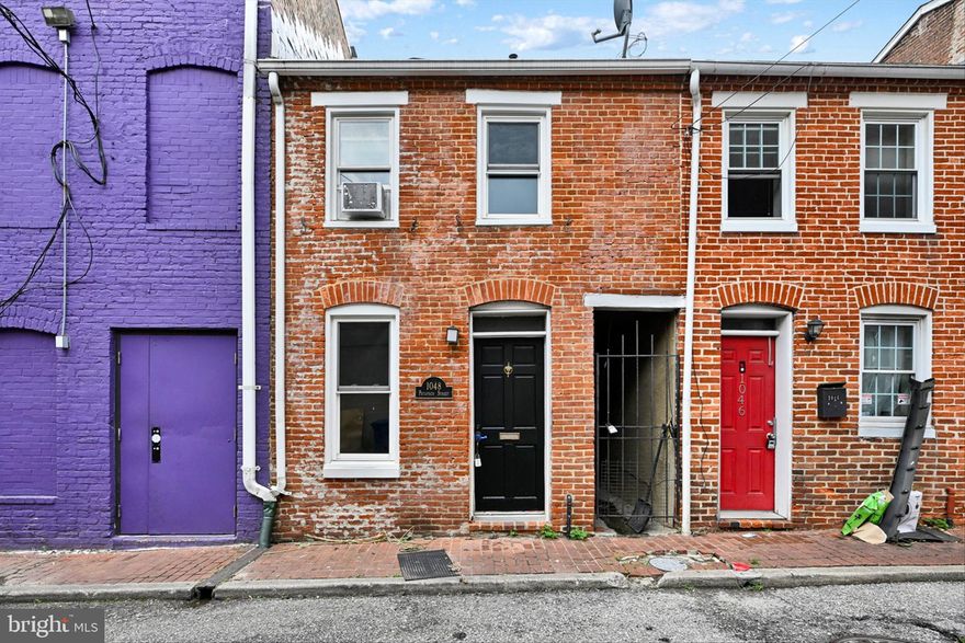 Welcome to 1048 Patapsco St! This charming townhouse is nestled in the heart of Federal Hill, right next to Cross Street Market. This delightful home boasts 2 bedrooms and 1.5 bathrooms, perfect for comfortable urban living. Step inside and be greeted by a warm and inviting first floor, featuring a living room, kitchen, dining room, and a family room adorned with a cozy fireplace, leading seamlessly to the rear patio entertaining area. Hosting gatherings with friends and family will be a breeze in this well-designed space. The kitchen is a chef's dream, equipped with a brand-new dishwasher and sleek stainless-steel appliances. Brand new flooring and paint throughout the house. Venture upstairs to the second level, where two spacious bedrooms await, each adorned with vaulted ceilings that enhance the feeling of openness and comfort. The primary bedroom treats you to a delightful surprise with its own private balcony, perfect for enjoying a morning coffee or unwinding after a long day. Convenience is key, and this townhouse makes laundry a breeze with a dedicated laundry room thoughtfully located on the second floor. The location couldn't be better; Federal Hill is known for its vibrant atmosphere, trendy eateries, and offers an array of shopping and dining experiences right at your doorstep. Don't miss out on the opportunity to call 1048 Patapsco St your new home. Come and experience the perfect blend of historic charm and modern amenities in this wonderful townhouse. Schedule a showing today!