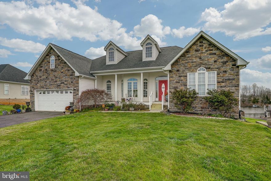 Envision your new lifestyle and start making memories in this beautiful waterfront retreat located on the public side of Lake Anna in the desirable Southwind Shores II community.  HIGH SPEED COMCAST XFINITY INTERNET AVAILABLE HERE! You'll enjoy gorgeous the moment you walk through the front door.  Over 4,000+ square feet, 3 bedrooms, 2 full baths.  Open floor plan with hardwood flooring, stone gas fireplace, large lakeside windows, tray ceilings, crown molding, granite counters, and an abundance of natural light.  You'll love dining in the morning room that has a bay window overlooking the water.  Split bedroom design features a primary lakeside suite with a tray ceiling, bay window, double vanity, jetted tub and separate shower.  Two other main level bedrooms and a full bath.  Washer and dryer convey!  Large unfinished walkout basement has been framed in for 2 lakeside bedrooms with sliding doors, a full bath and a recreational area.  The basement also has a built in garage with shelving that is perfect for storing your tools and lawn mower.  Take a stroll down by the waters edge where you'll enjoy your enclosed covered boathouse with a roll up door, a second uncovered open slip, storage room, sun deck and a manual jet ski lift.  Over 120 feet of rip-rap shoreline and a sandy beach area.  Beautiful open sunny yard, 2 car attached garage and a paved driveway complete this beauty.  It's the perfect place to unwind, relax and let your stress drift away....
**PLEASE NOTE THERE IS AN AUCTION TAKING PLACE INSIDE THE HOME FOR PERSONAL BELONGINGS, PLEASE EXCUSE ANY CLUTTER IN PHOTOS & DURING SHOWINGS**