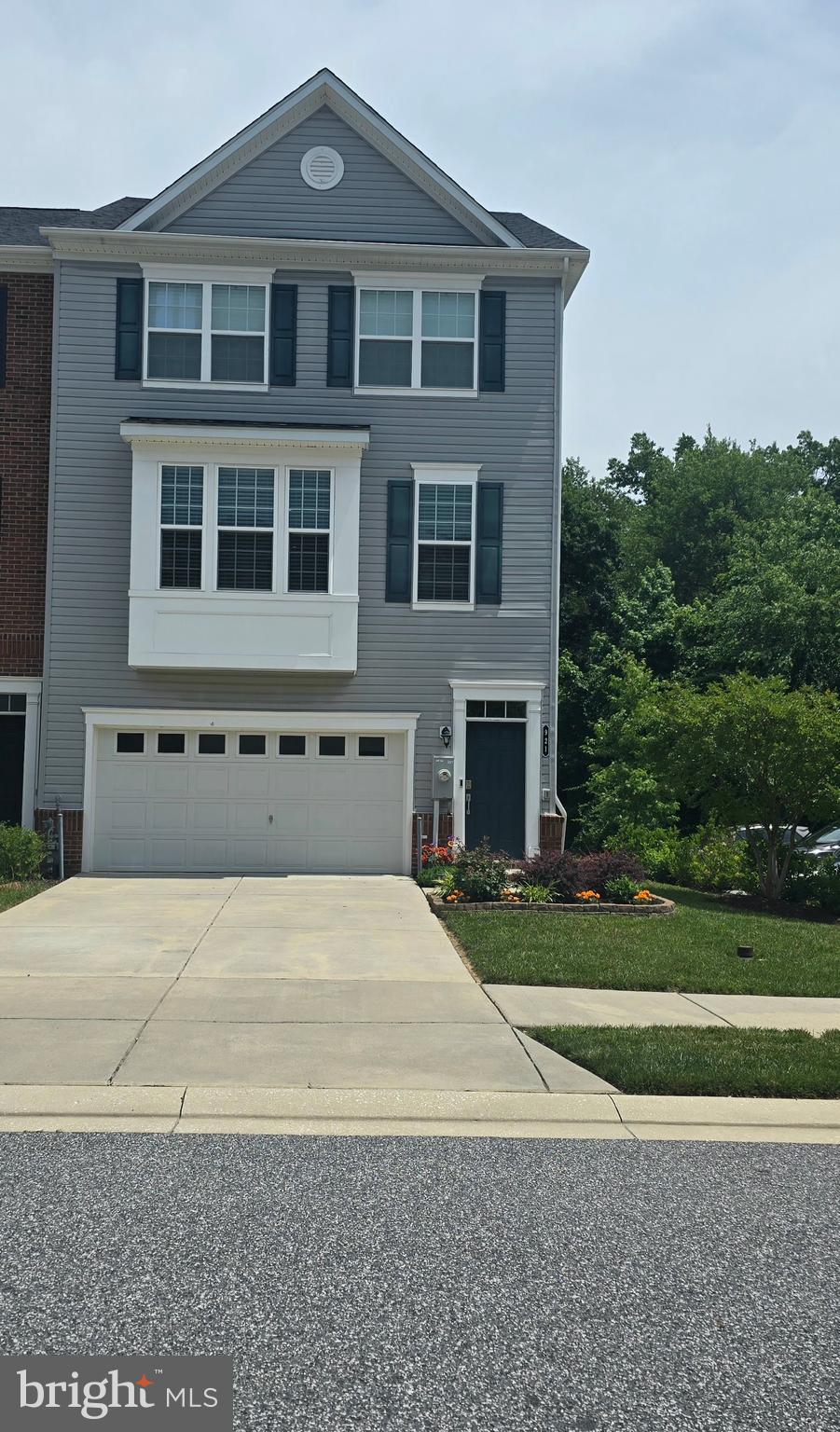 Come see this well-maintained end-of-group townhome in The Preserve at Windlass Run – Backing to Serene Woods! Welcome to your dream home in the heart of Middle River! This spacious 2,500+ sq ft end-of row home is move in ready with great features! Step inside this open and airy home bathed in natural light. The heart of this home is the kitchen featuring an expansive center island with granite counters and a large deep sink. The kitchen also offers stainless steel appliances included with loads of cabinet space, an upgraded pantry and a coffee bar space featuring tile accents. The large dining space is open to the kitchen perfect for entertaining! There is also a powder room, and large family room on this level all with convenient LVP flooring. You can also access the TREX deck from this level which offers the privacy of serene woods, no townhomes behind you! The upper level offers a spacious primary suite with a walk in closet and primary bathroom with tiled stall shower and double bowl vanity. There are two other bedrooms that share a full bathroom as well as the laundry room. The lower level is finished for additional family room or TV space, play room, office, den, etc. This area also features an additional powder room and walk out to the yard. This home is also beside one the community parking lots. Close to all major highways, restaurants, shopping etc. Come see this today while it lasts!