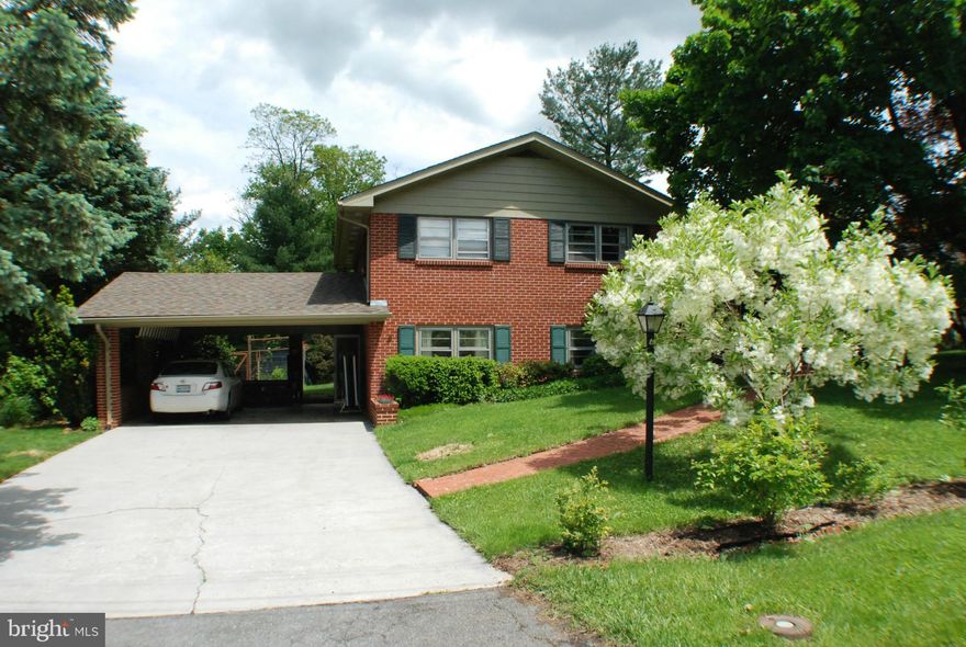 Well maintained naturally lit split level home in great walkable neighborhood near schools, grocery stores, playground .Expansive gardens with mature landscaping and edibles including strawberries, blueberries and too many perennials, vegetables and herbs to list.Home has hardwood floors, solar tubes,3 season porch, hot water heat, 2 wood burning fireplaces and lower level work shop.6 Min. to I-66