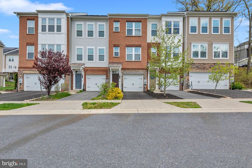 Welcome to 2818 Etley Court in Hanover! This stunning 3-bedroom, 3.5-bathroom home offers modern comfort in a vibrant, amenity-rich neighborhood. Enjoy open-concept living with hardwood floors throughout the main level, a sleek kitchen with granite counters and stainless steel appliances.  Flowing right off the kitchen is a deck backing to serene woods, perfect for entertaining.  Continue from the kitchen into the open concept living area with plenty of room for a dining table.  Upstairs are 2 bedrooms, conveniently located laundry, and a master suite featuring a walk-in closet and a spa-like bathroom. From the lower level, step outside to the beautiful brick patio, a naturally lit downstairs bedroom, or access the spacious one-car garage. The home sits on a prime lot with extra front parking and access to top-tier community amenities: 3 pools, dog parks, community grills, sidewalks, a gym, and a clubhouse.  All this with easy access to I-95, 295, DC, Baltimore, and Annapolis!