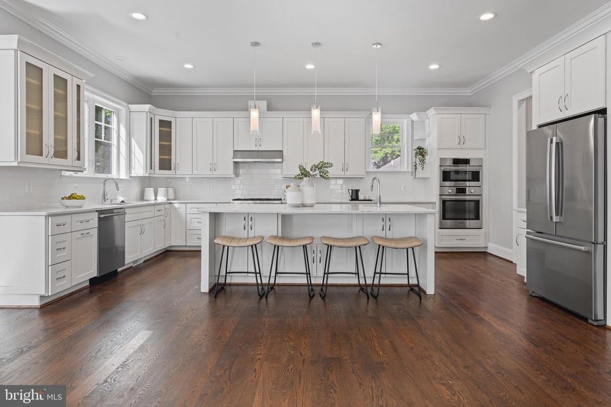 Welcome to 7606 Leonard Drive — five bedrooms, five bathrooms, and over 6,300 square feet of thoughtfully designed living space in the heart of Pimmit Hills, one of Northern Virginia's most connected communities.

Built in 2019, the home opens to soaring ceilings, rich hardwood flooring, and custom millwork that set the tone for the modern Craftsman character carried throughout. The gourmet kitchen anchors the main level — outfitted with professional-grade stainless steel appliances, a six-burner range, an oversized island with bar seating, and expansive quartz countertops built for both weeknight dinners and weekend entertaining.
The living spaces flow naturally from the formal dining area into the family room, where custom built-ins and a fireplace create an easy sense of warmth. Large windows pull in natural light and frame views of the landscaped backyard. The floor plan handles both scale and intimacy well — equally suited to a dinner party of twenty or a quiet evening in.

Upstairs, the primary suite delivers: a spa-like en-suite with soaking tub, dual vanities, and a walk-in shower. Additional bedrooms are generously sized with their own baths, and the fully finished lower level gives you the flexibility to build out a home theater, gym, or recreation space to fit how you actually live.

Outside, a private yard on a 10,000+ square foot lot is ready for alfresco dining, weekend barbecues, or a quiet evening under the stars.

And then there's the location. Pimmit Hills puts you minutes from Tysons Corner's world-class shopping, dining, and employment hub — with two Metro stations close at hand. The West Falls Church station (Orange & Silver Lines) sits less than a mile from the neighborhood's southern edge, and the McLean station (Silver Line) is roughly two miles to the north. Whether you're commuting into D.C. or heading out to Dulles, you have real options.

7606 Leonard Drive is the rare home that doesn't ask you to compromise — on space, on design, or on where you want to be.