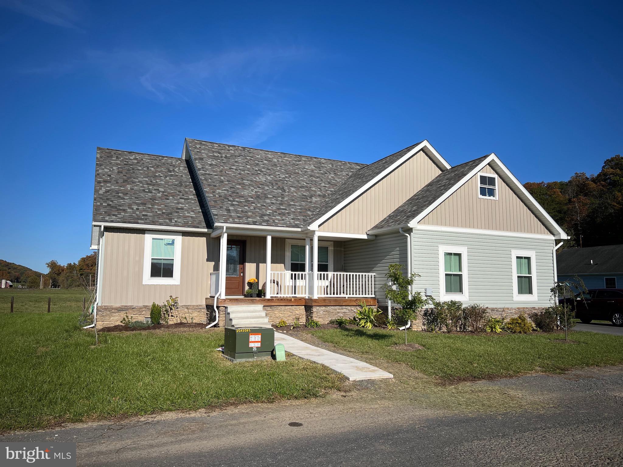 PRICE DROP, ACT FAST, DON’T MISS OUT! Modern Country Living with Stunning Views – 4-Bed, 2-Bath Home on 0.33 Acre
Easy Commute to major employers ABL/ATK DOD contractor, UPMC Western Maryland (Cumberland hospital), Allegany College, Rocky Gap Resort, Frostburg State University, CSX, American Woodmark, Western and North Branch Correctional Institutions. Plenty of great options within an short drive for shopping, restaurants, grocery, schools, etc!
Step into this beautifully crafted 4-bedroom, 2-bathroom home built in 2021, offering over 2,100 square feet of pristine living space. Nestled on a level 0.33-acre lot, this property combines modern elegance with serene country living.
As you approach the home, you’ll immediately notice its excellent curb appeal, featuring a tasteful mix of stone veneer, vinyl, and aluminum siding in complementary tones. The decorative glass front door and covered front porch welcome you to the spacious, open floor plan inside.
The main living area boasts cathedral ceilings, luxury vinyl plank (LVP) flooring, recessed lighting, and an airy flow from the living room to the dining area and modern kitchen. The kitchen is a chef’s dream, featuring a large island with bar seating, granite counters, stainless steel appliances, and a picturesque view of farmland and distant mountains through the kitchen windows.
The spacious owner's suite on the main floor includes an adjoining walk-in closet and a private en-suite bath with tasteful tile flooring. Two additional bedrooms and a full bathroom are also located on the main floor. Upstairs, you’ll find a versatile fourth bedroom, large enough to serve as a bonus or recreation room, complete with a walk-in closet and climate control.
This property offers paved roads leading to a 2-car garage and the convenience of public water & Sewer. The backyard is fenced on two sides, perfect for pets or a garden, and the covered rear porch is the ideal spot to take in the gorgeous views.
Priced competitively below comparable new homes of this quality, this move-in-ready home offers low property taxes and is waiting for its next owner to enjoy its beauty and comfort.
Don’t miss out on this rare gem—schedule a tour today!
